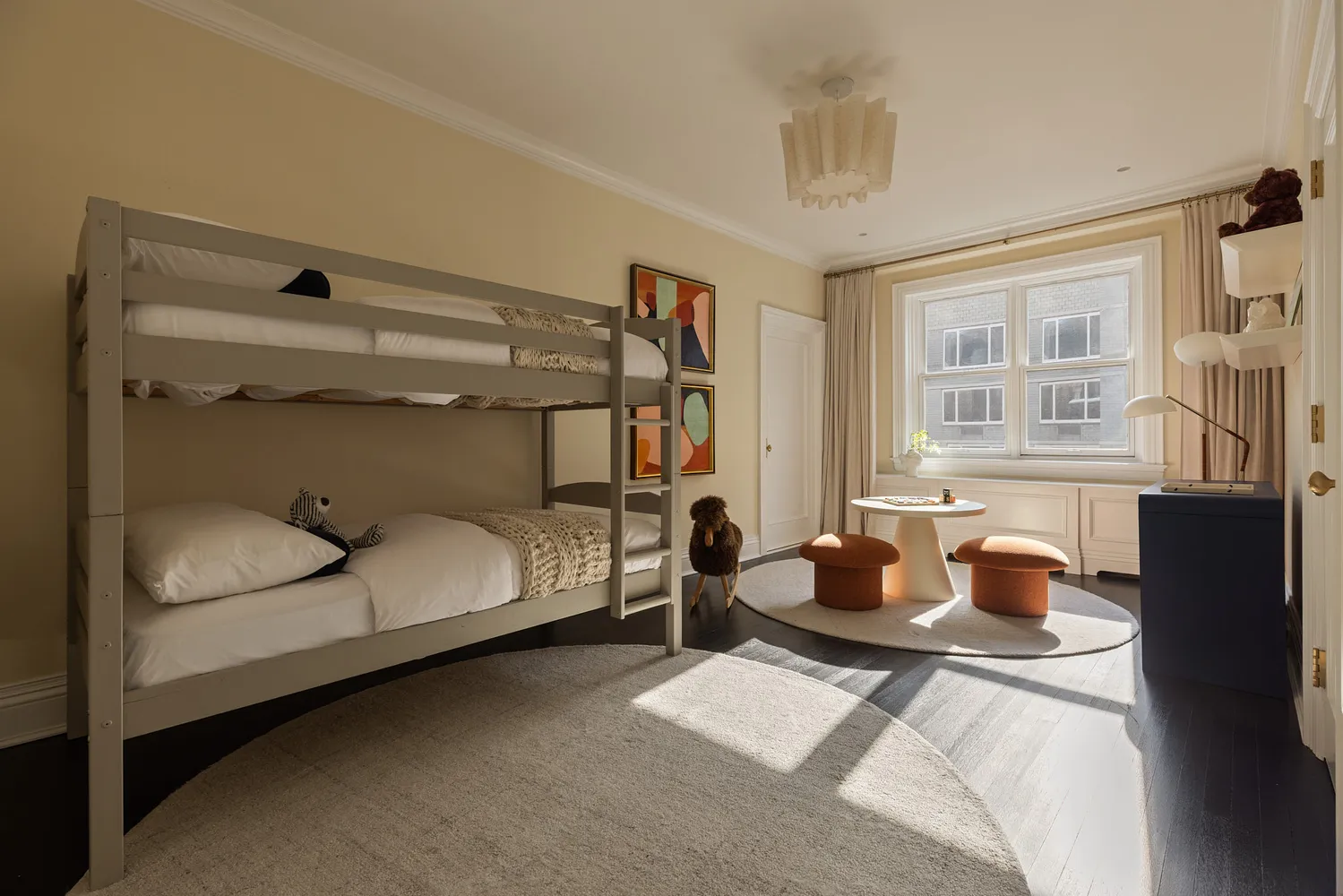 a bedroom with furniture and a window