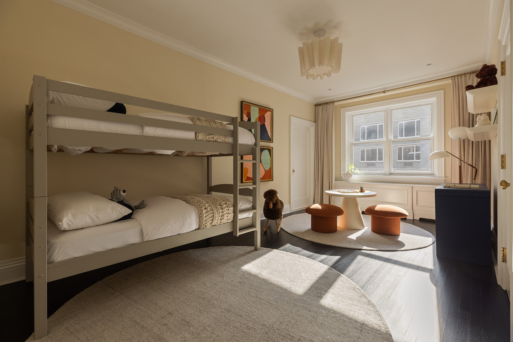 350 East 57th Street, Unit 15B Manhattan, NY 10022 - Photo 12 of 20 a bedroom with furniture and a window