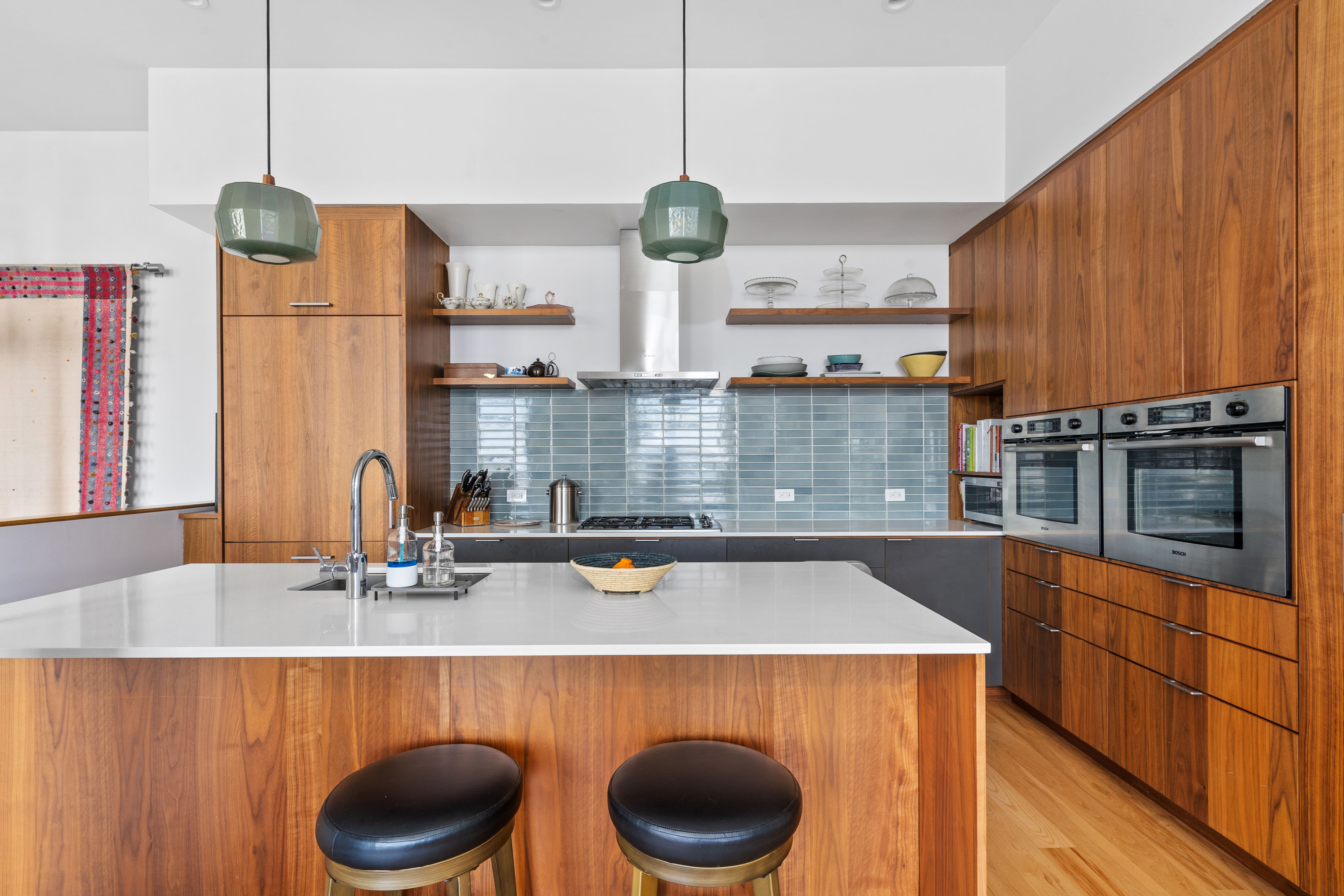 360 Furman Street, Unit 734 Brooklyn, NY 11201 - Photo 5 of 31 a kitchen with a sink a stove and a wooden floor