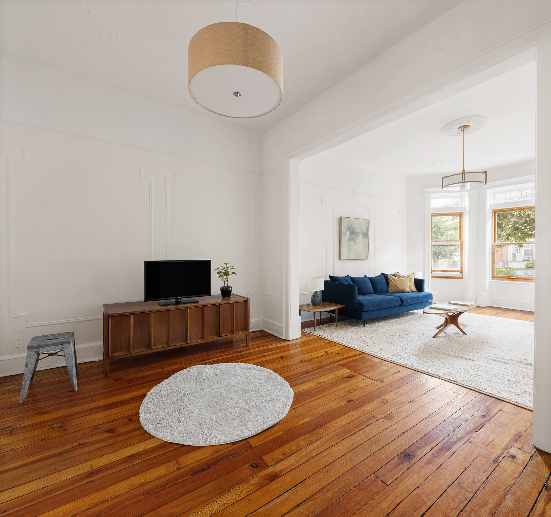 195 Lefferts Avenue Brooklyn, NY 11225 - Photo 5 of 18 a living room with furniture and a flat screen tv