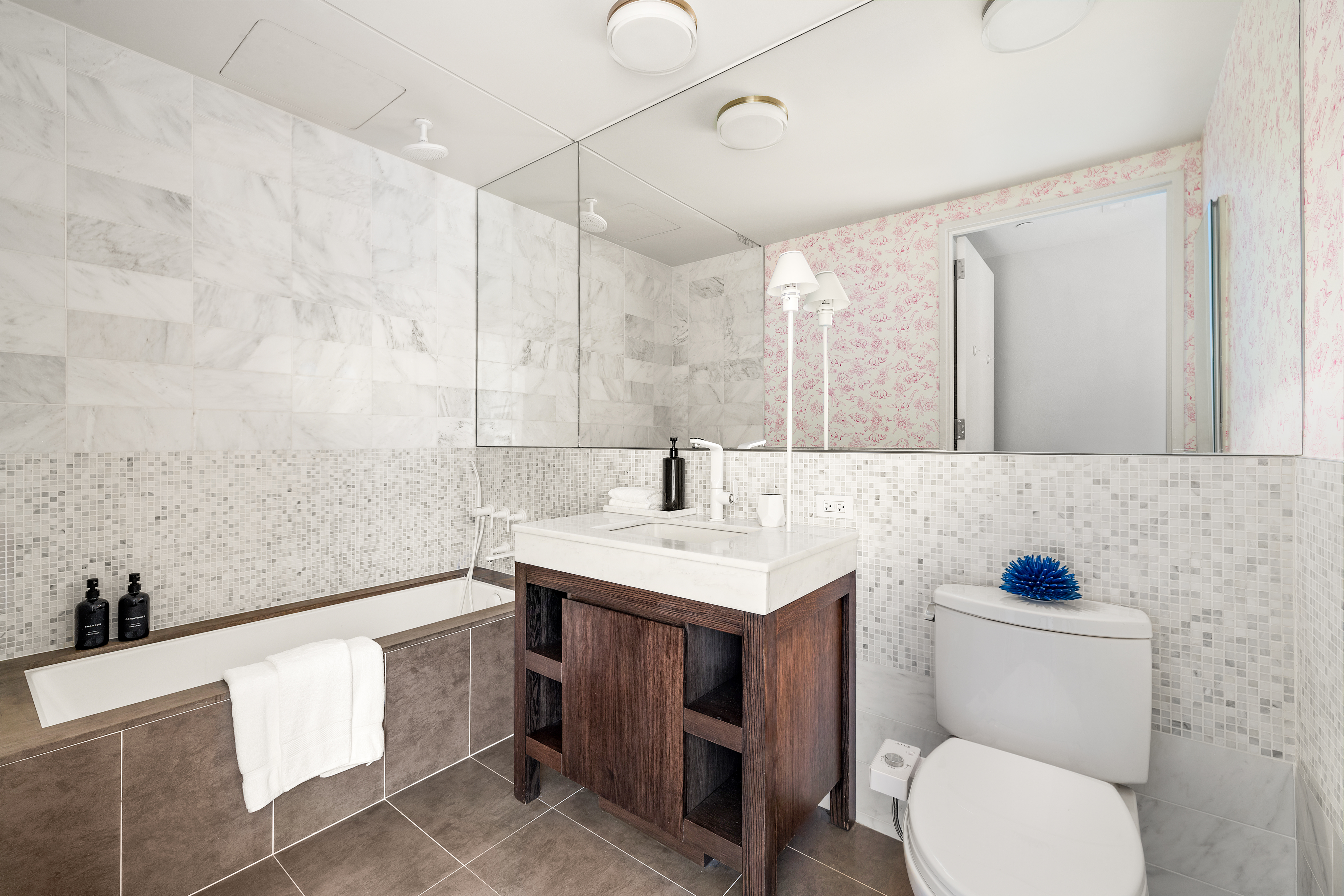 35 West 15th Street, Unit 14D Manhattan, NY 10011 - Photo 8 of 18 a bathroom with a toilet sink and mirror