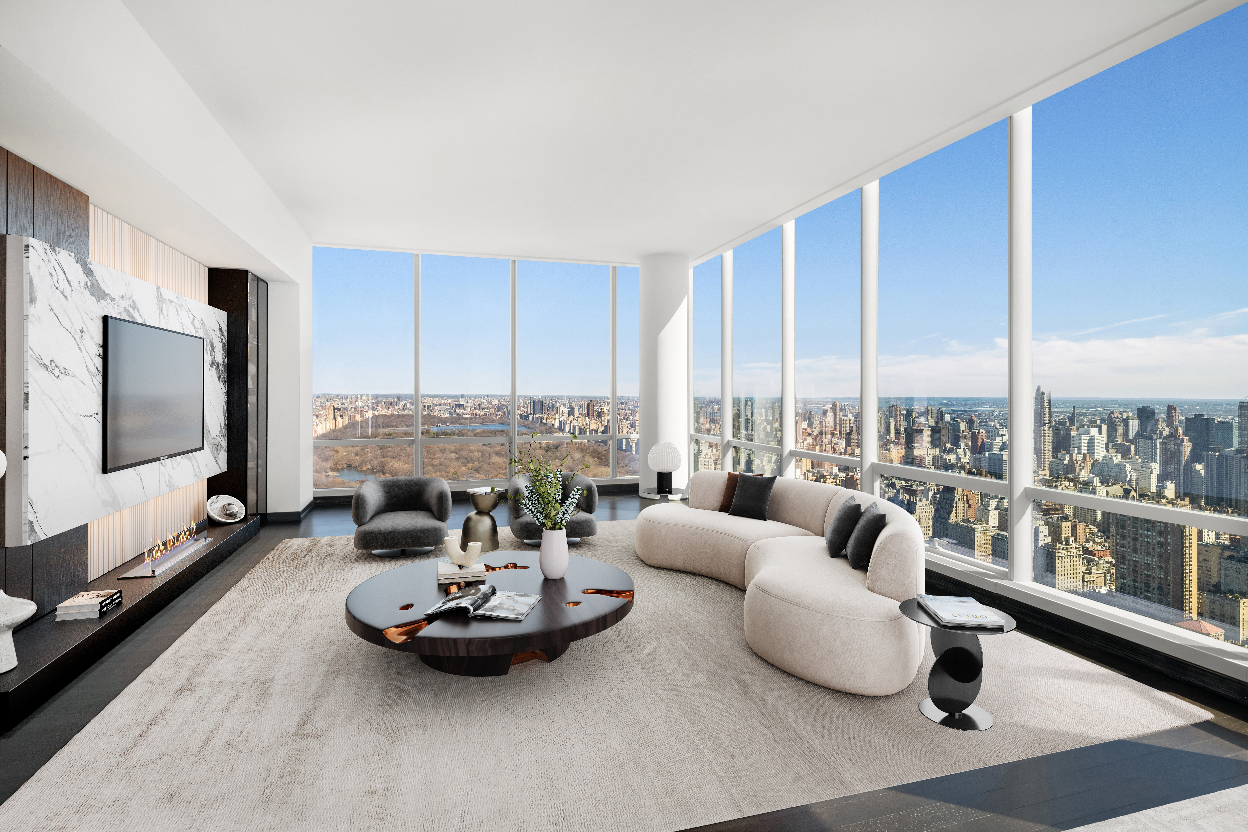 157 West 57th Street, Unit 56C Manhattan, NY 10019 - Photo 1 of 10 a living room with furniture and a flat screen tv