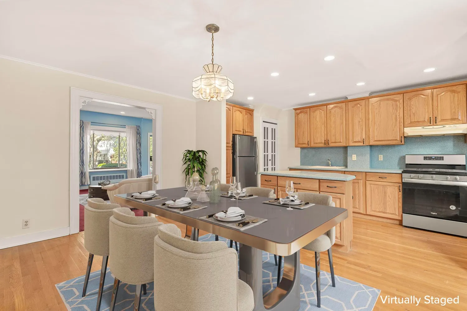 a kitchen with a dining table chairs and stove