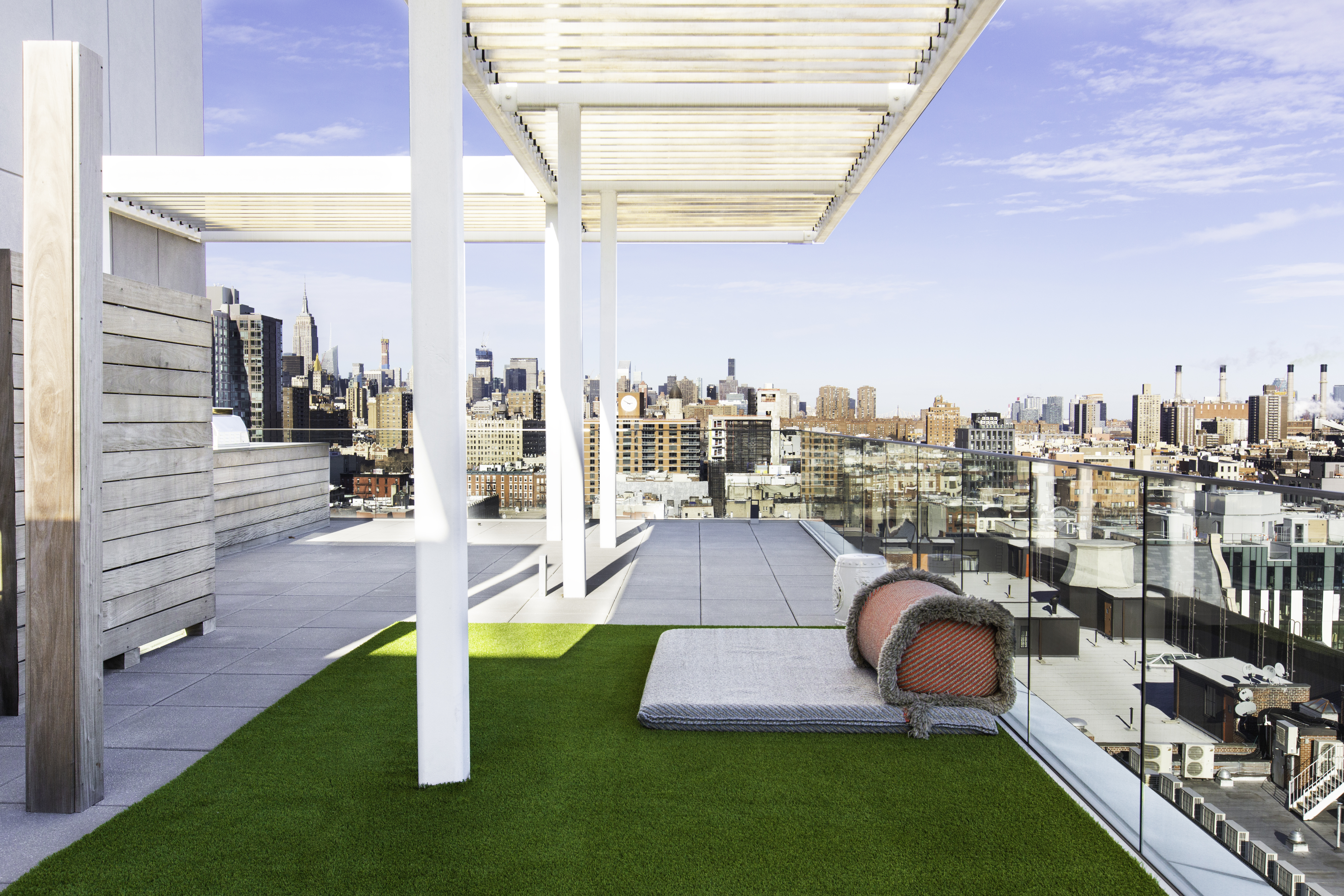 a swimming pool with outdoor seating and yard