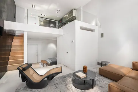 a kitchen that has a sink and a stove in it