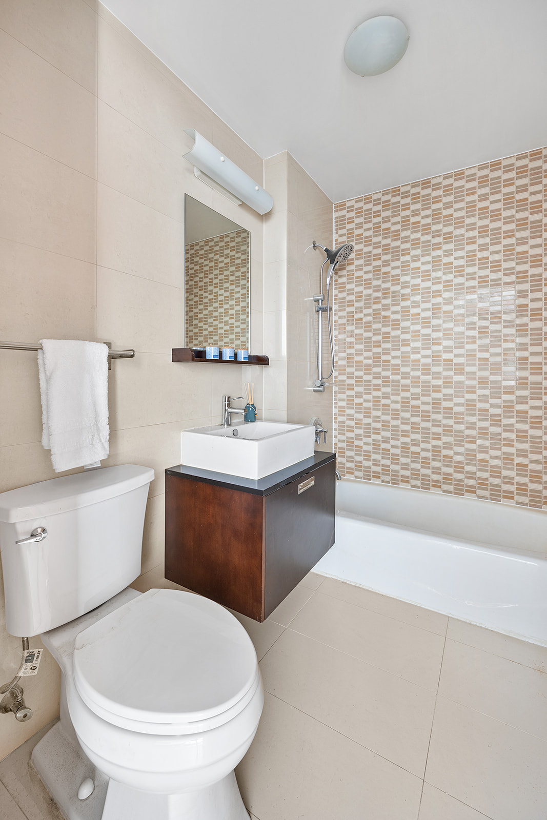 502 9th Avenue, Unit 4A Manhattan, NY 10018 - Photo 4 of 9 a bathroom with a sink toilet and shower