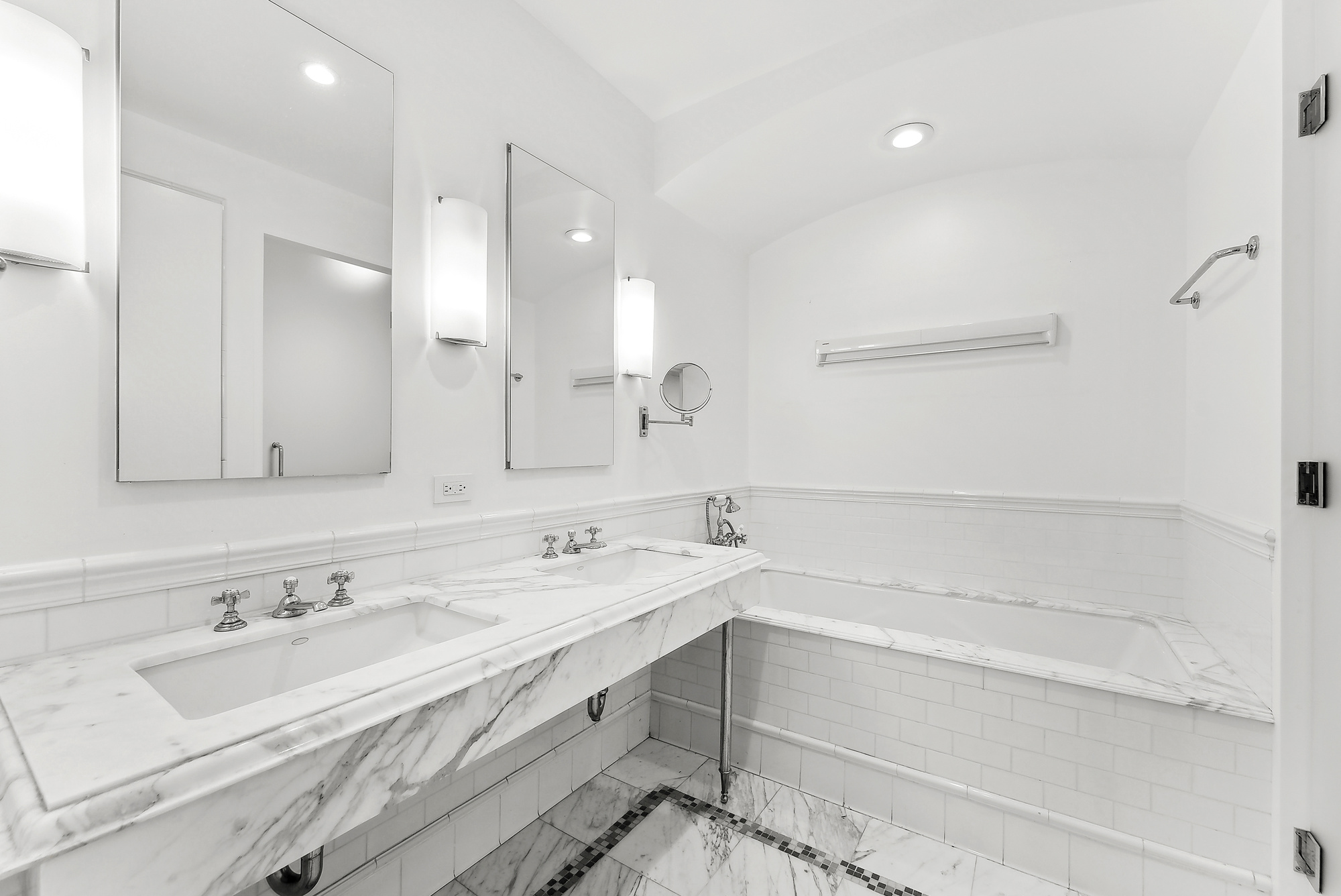43 West 64th Street, Unit 4D Manhattan, NY 10023 - Photo 6 of 11 a bathroom with a sink double vanity and a bathtub