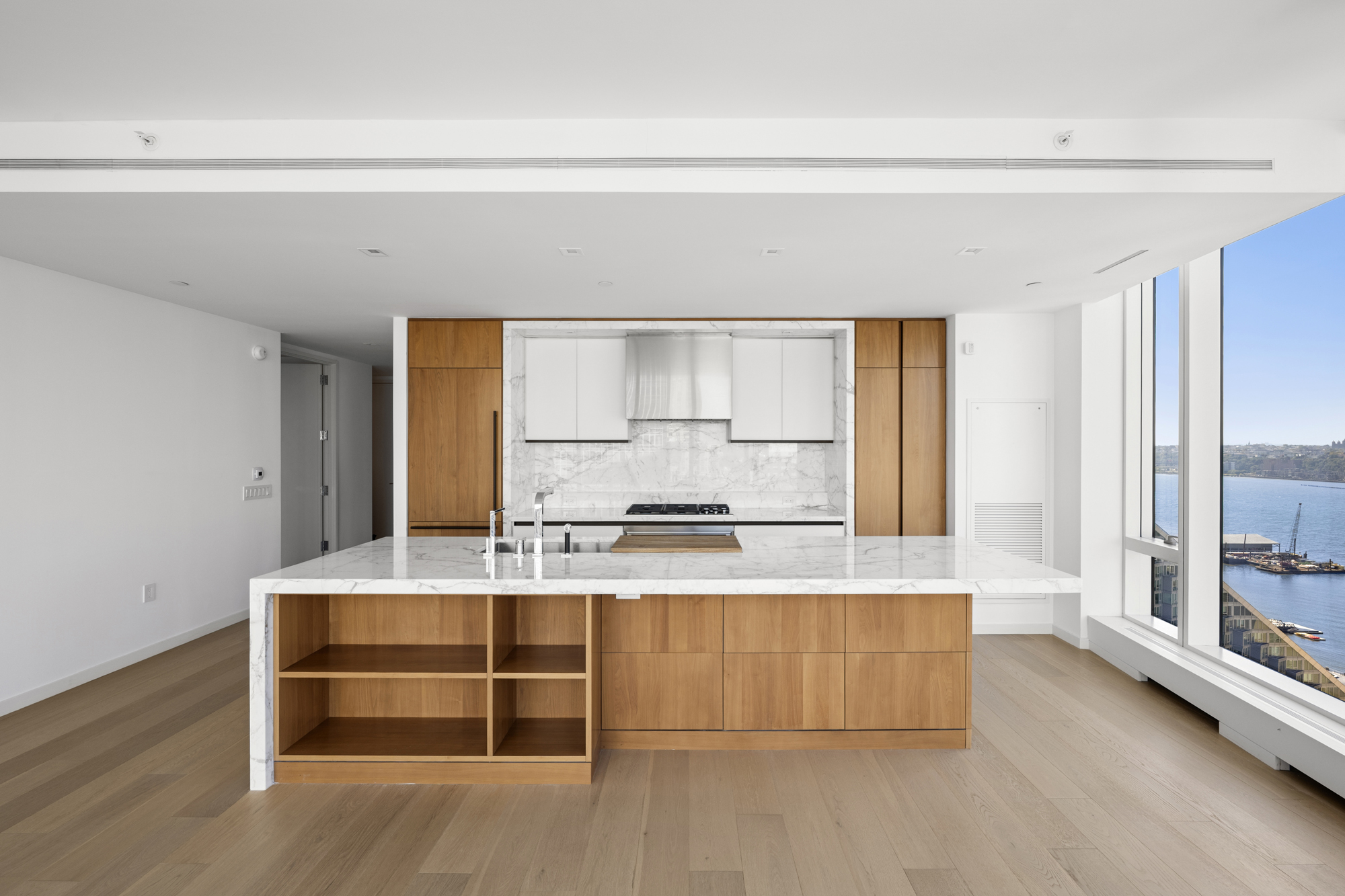 1 West End Avenue, Unit 26G Manhattan, NY 10023 - Photo 6 of 33 a view of kitchen with wooden floor and electronic appliances