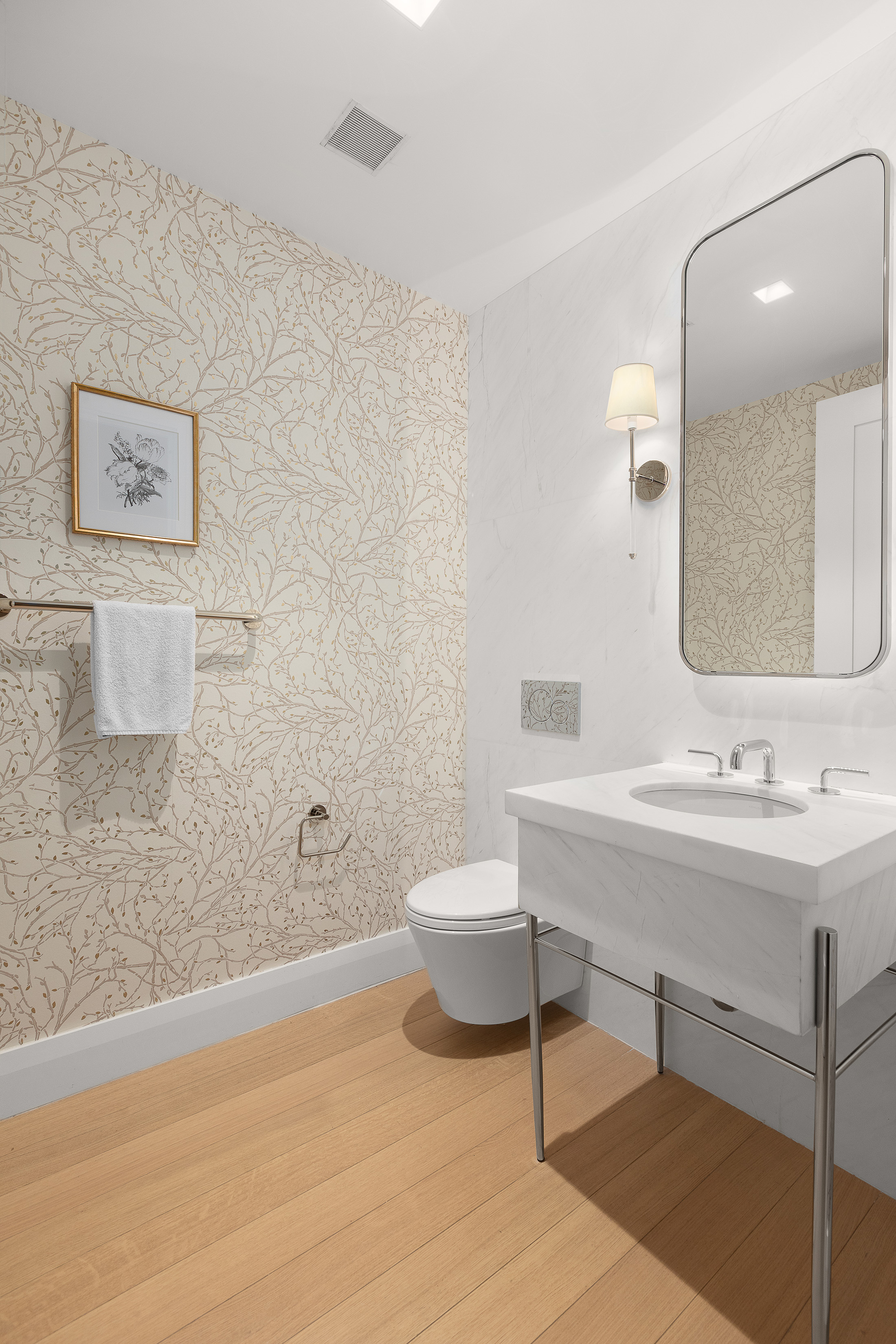 200 East 83rd Street, Unit 8C Manhattan, NY 10028 - Photo 11 of 26 a bathroom with a toilet a sink and mirror