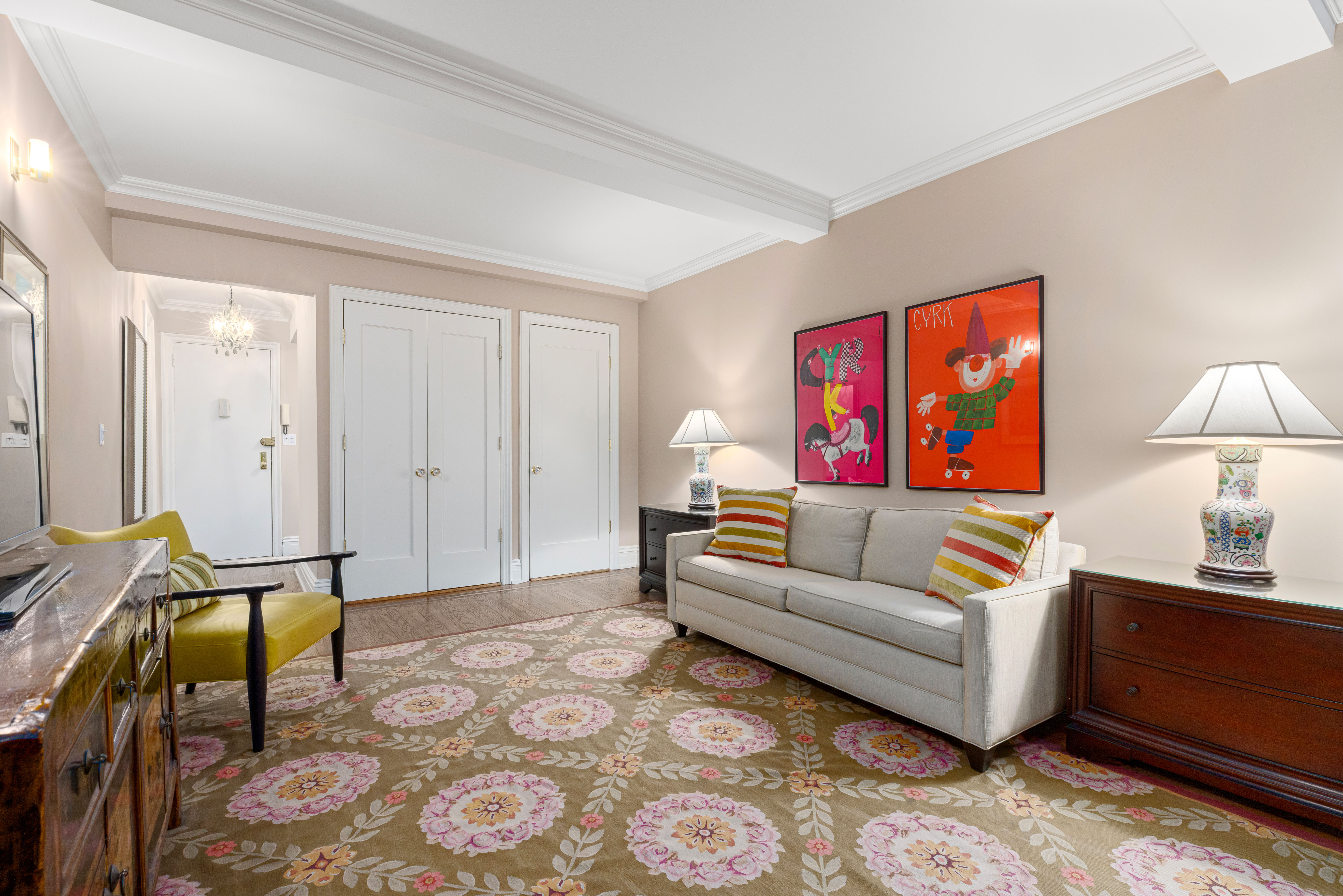 235 West 102nd Street, Unit 3B Manhattan, NY 10025 - Photo 3 of 20 a living room with furniture and a lamp