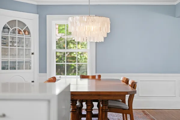 a view of a room that has a window and a potted plant