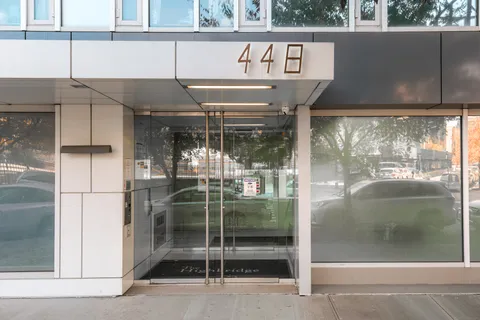 a bathroom with a glass shower door