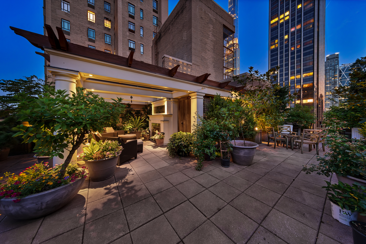 25 Central Park West, Unit 21J Manhattan, NY 10023 - Photo 33 of 37 a view of a chairs and tables in the patio