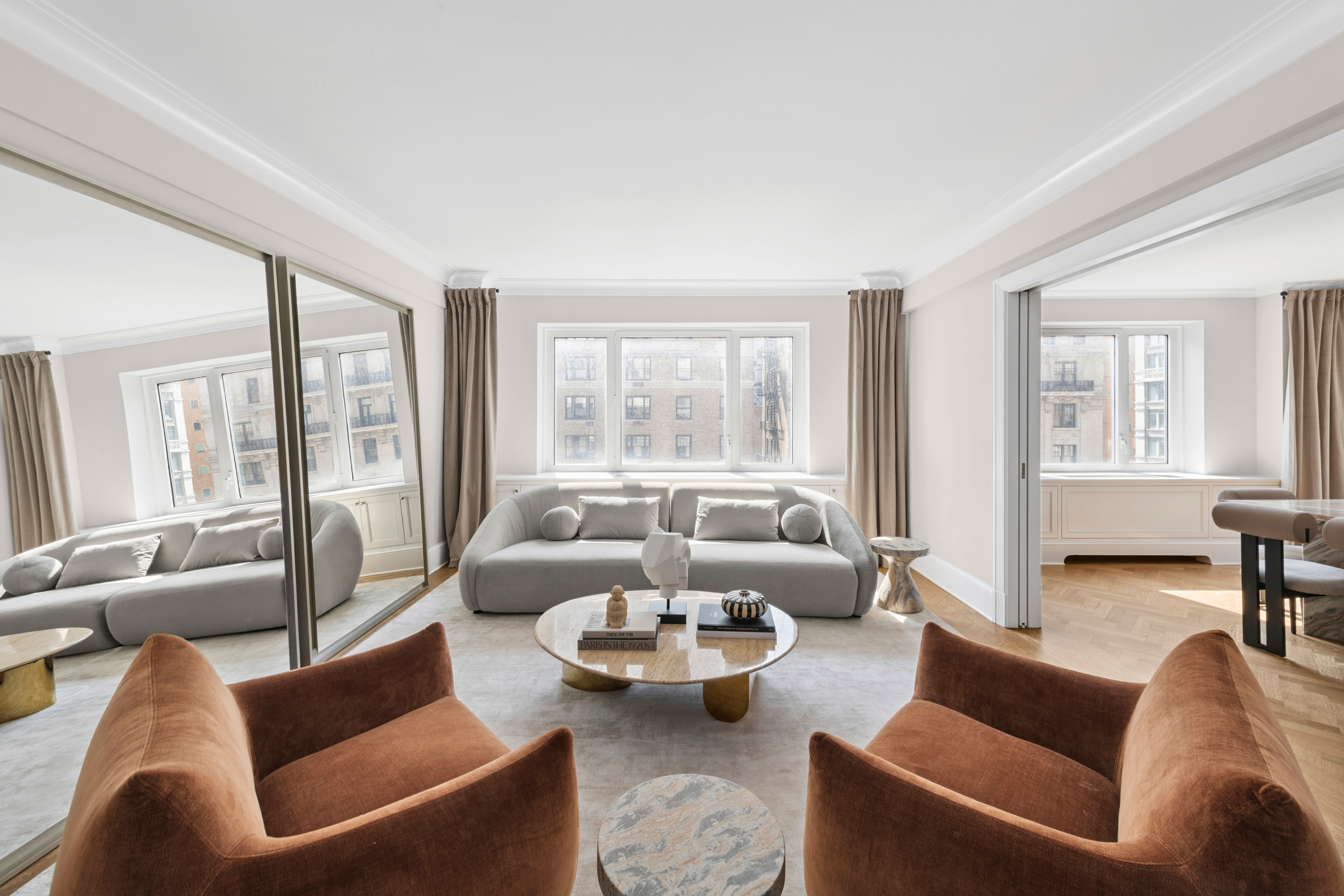 530 Park Avenue, Unit 12A Manhattan, NY 10065 - Photo 3 of 27 a living room with furniture and a large window