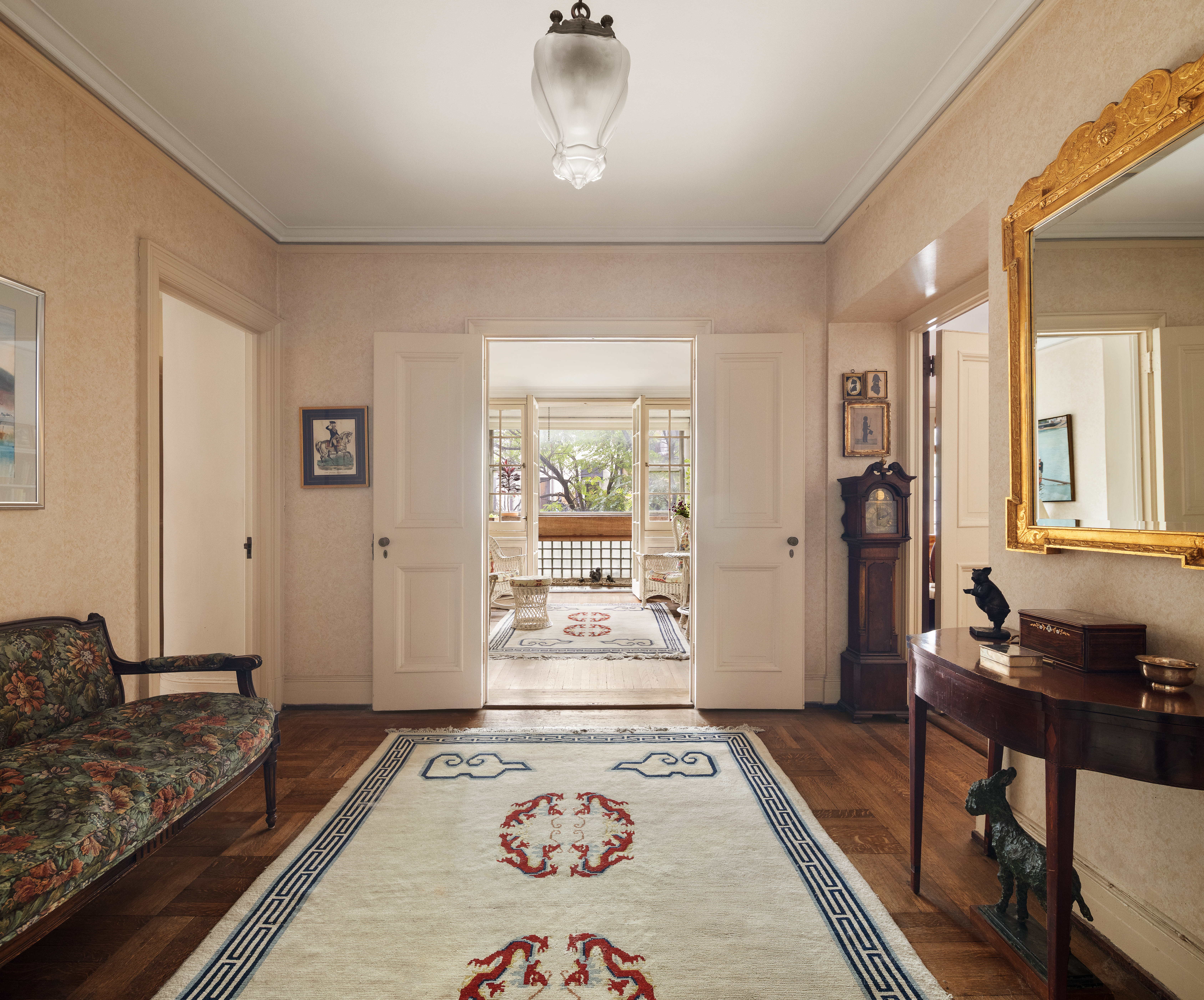 136 East 79th Street, Unit 4B Manhattan, NY 10075 - Photo 7 of 14 a bedroom with a bed and wooden floor