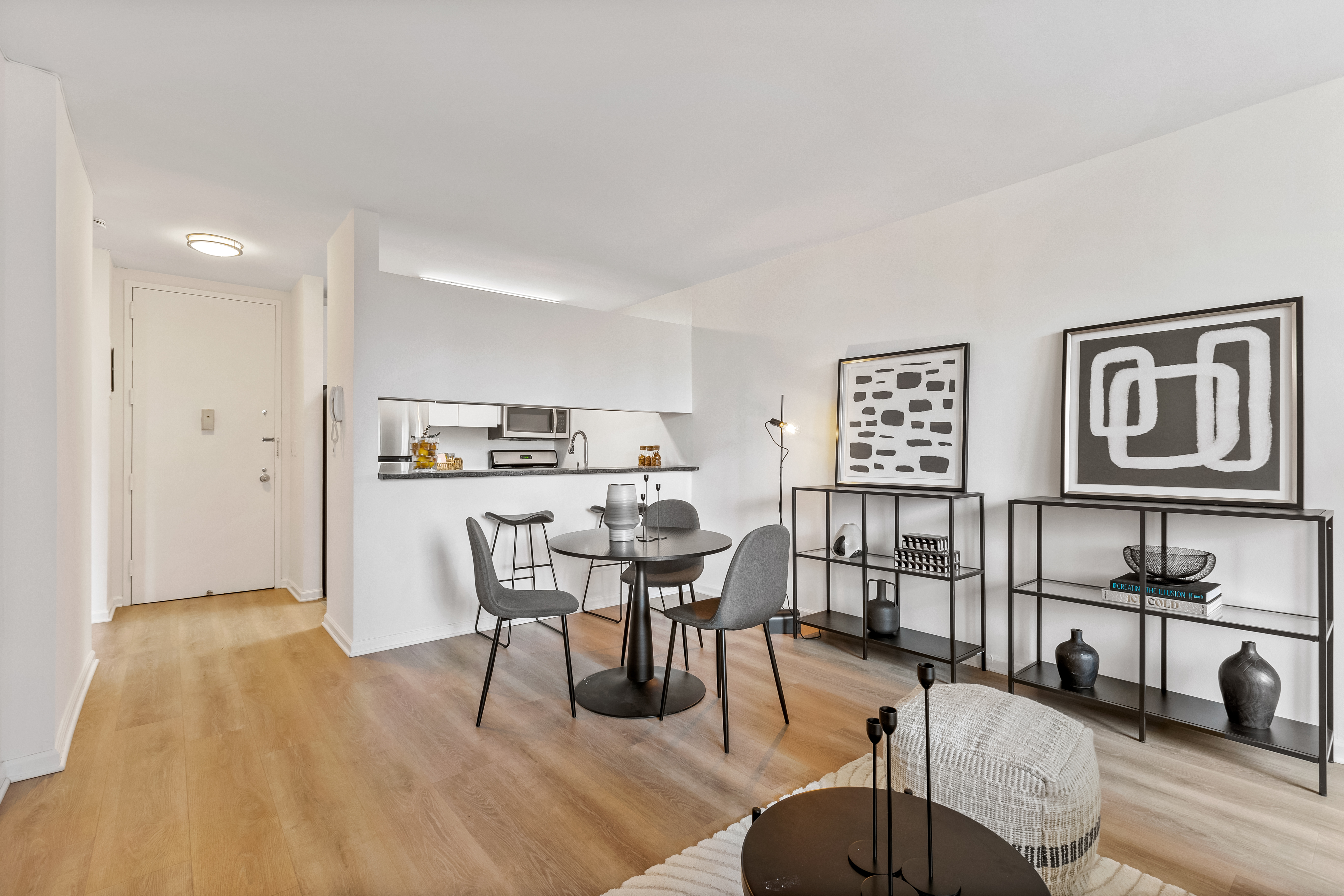 157 East 32nd Street, Unit 8A Manhattan, NY 10016 - Photo 3 of 16 a view of a dining room with furniture and wooden floor