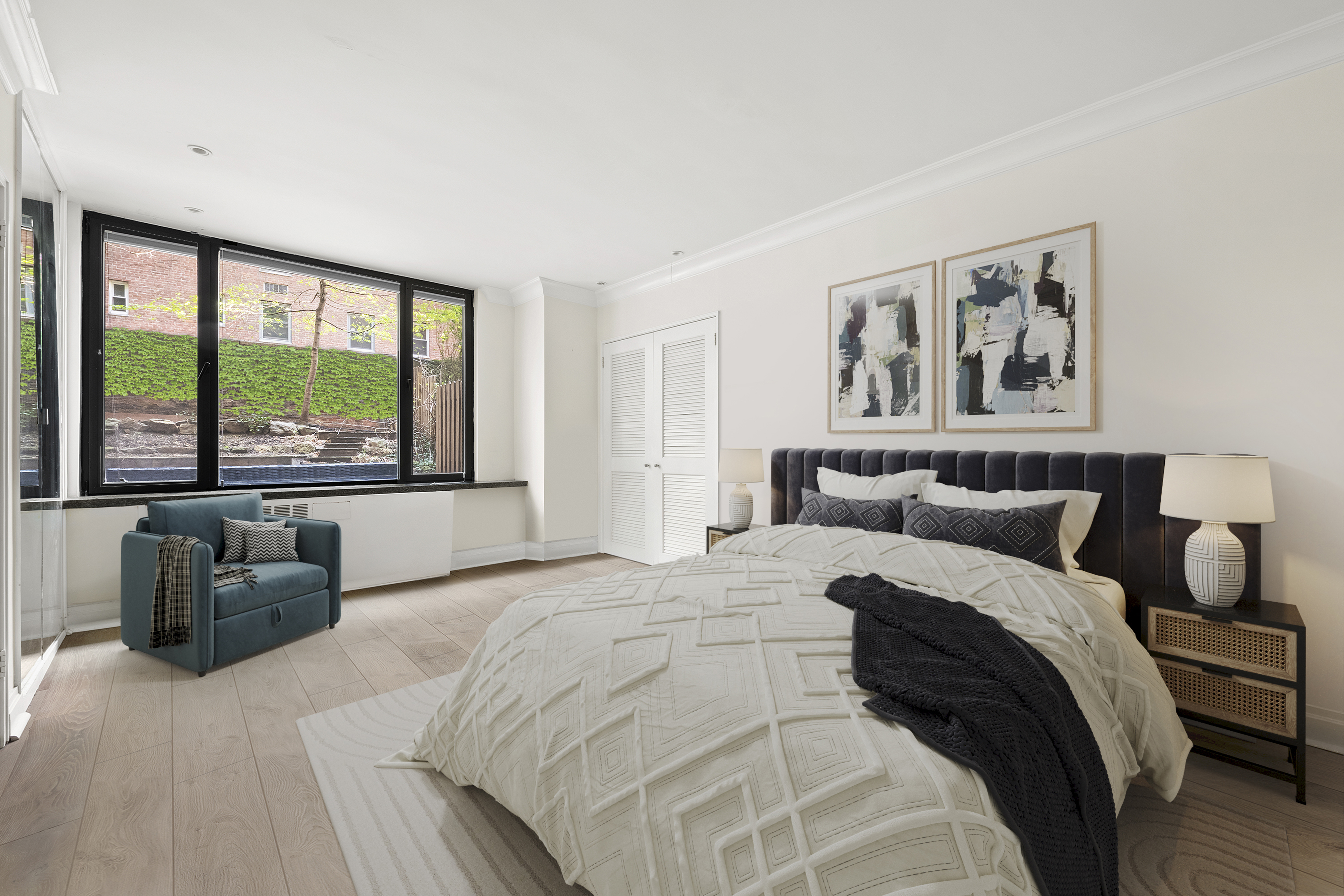 440 East 57th Street, Unit 1G Manhattan, NY 10022 - Photo 7 of 10 a spacious bedroom with a large bed and a large window