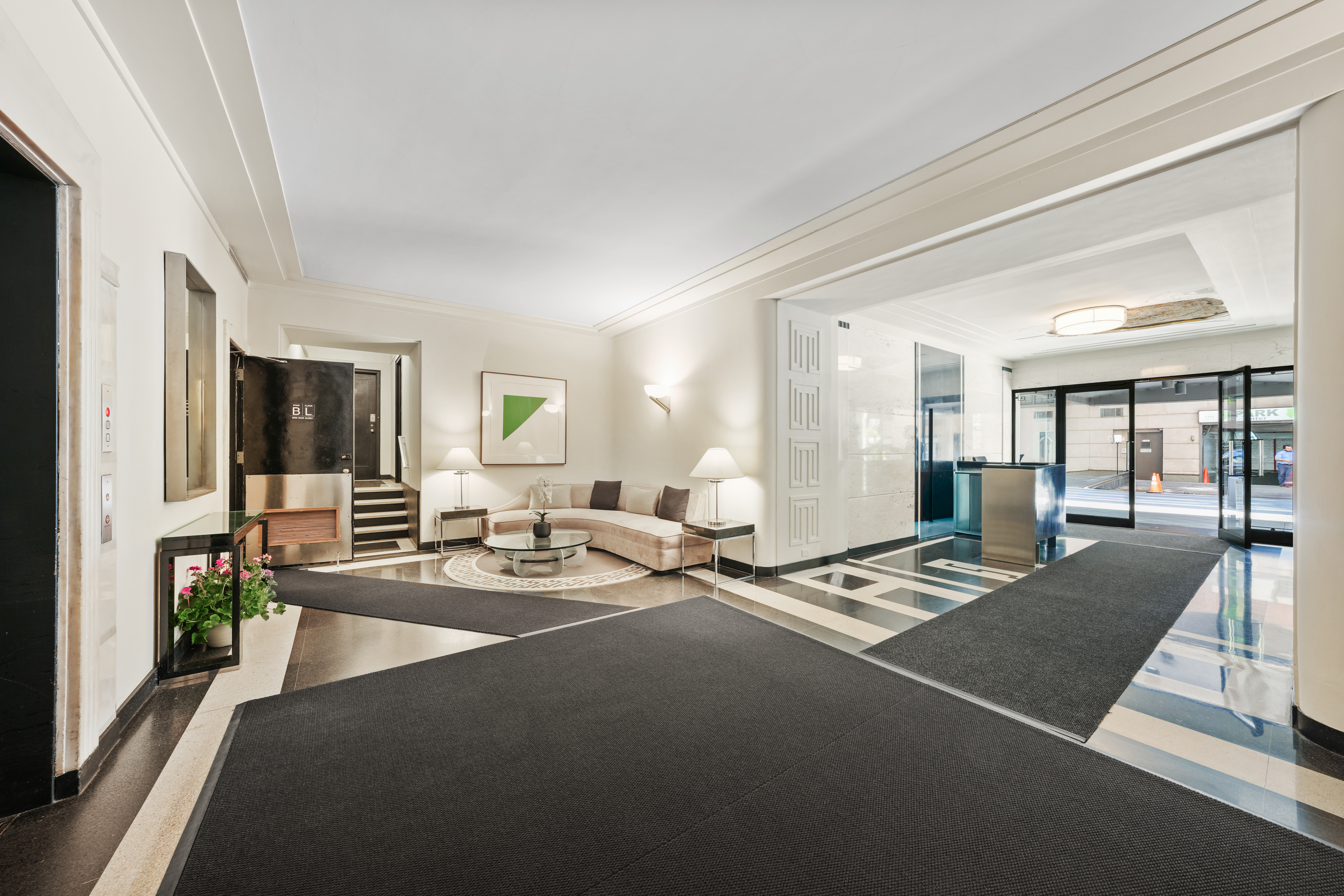 177 East 77th Street, Unit PHC Manhattan, NY 10075 - Photo 22 of 26 a living room with furniture and a table