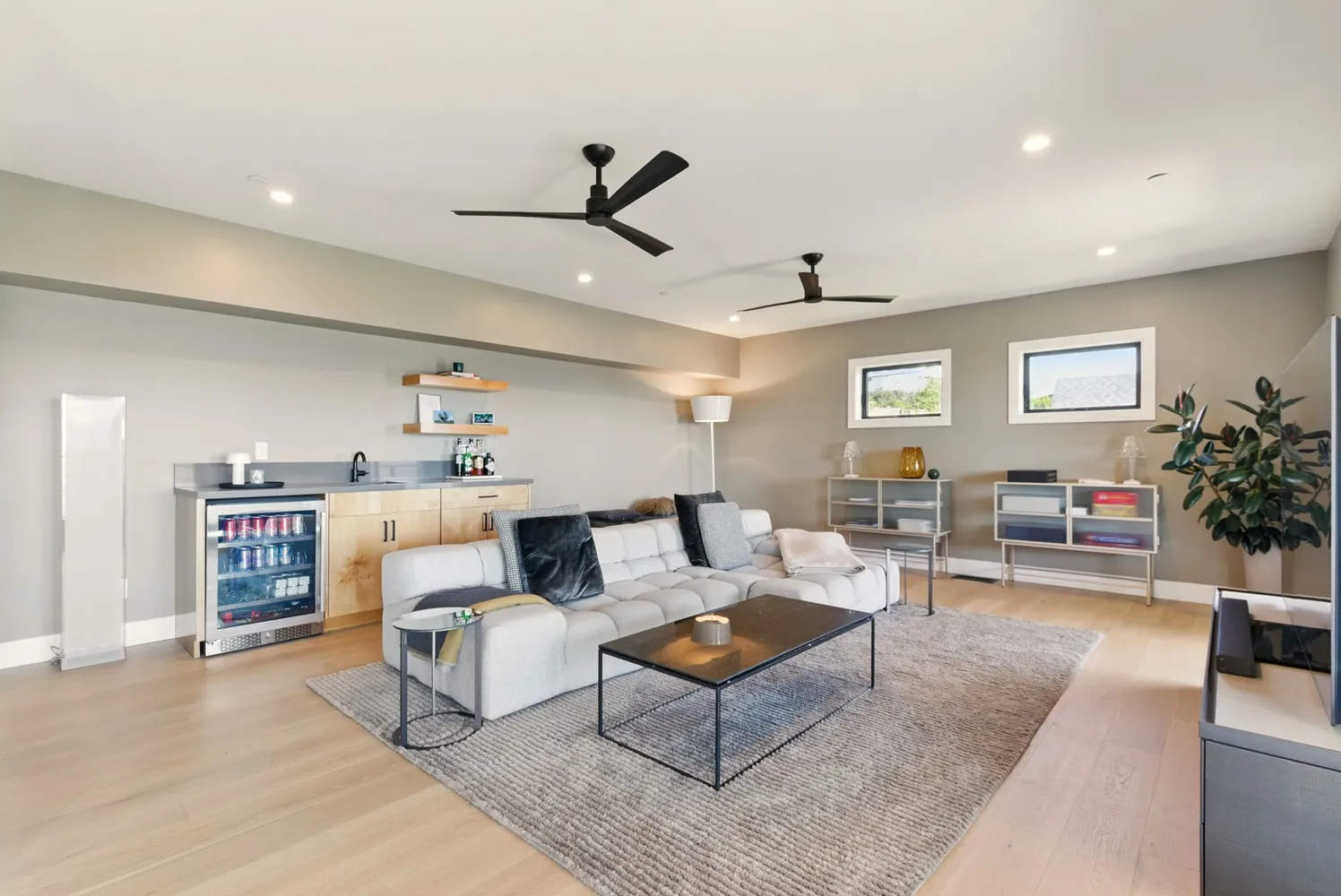 a living room with furniture and wall painting