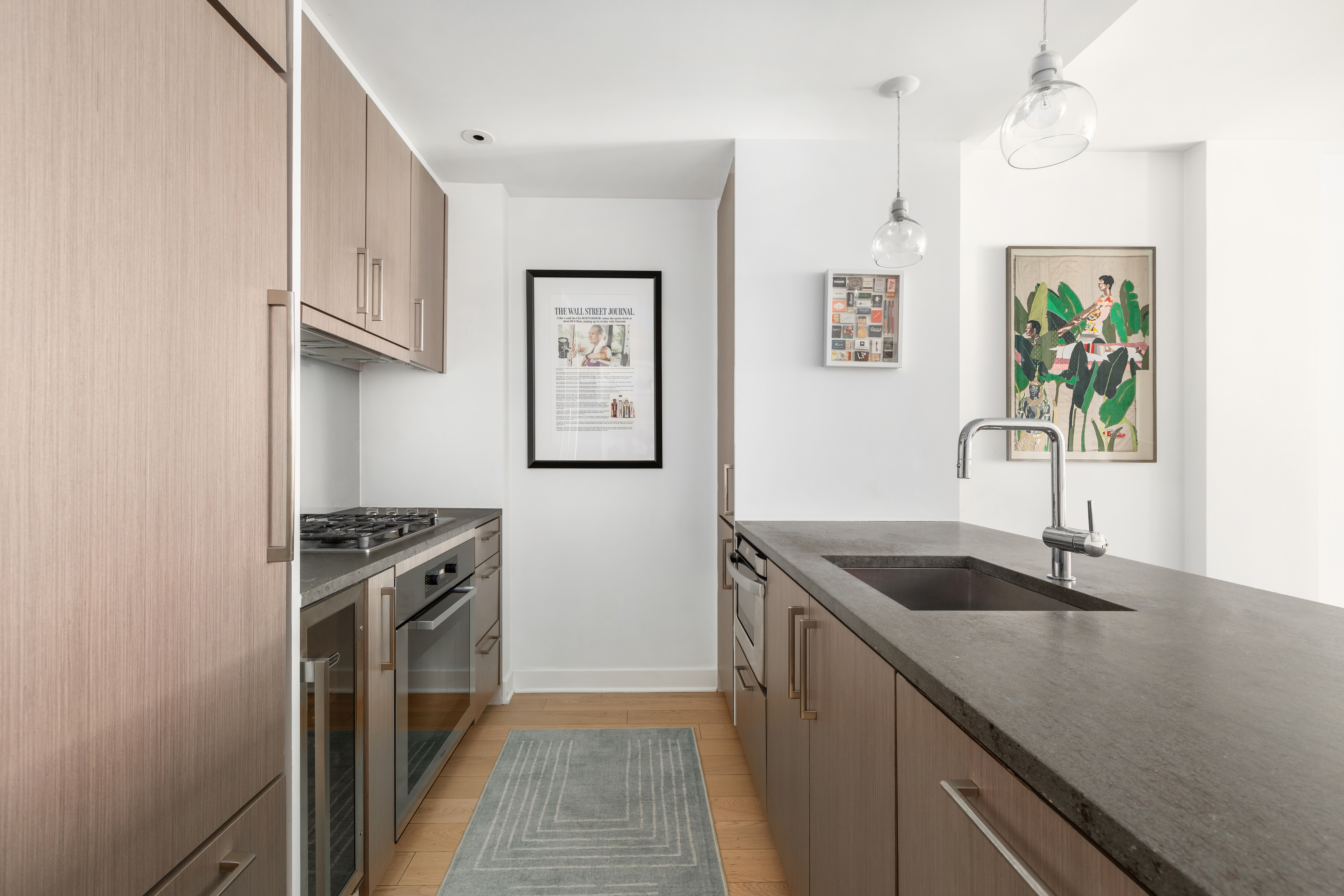 160 East 22nd Street, Unit 3A Manhattan, NY 10010 - Photo 3 of 7 a kitchen with stainless steel appliances granite countertop a sink stove and refrigerator