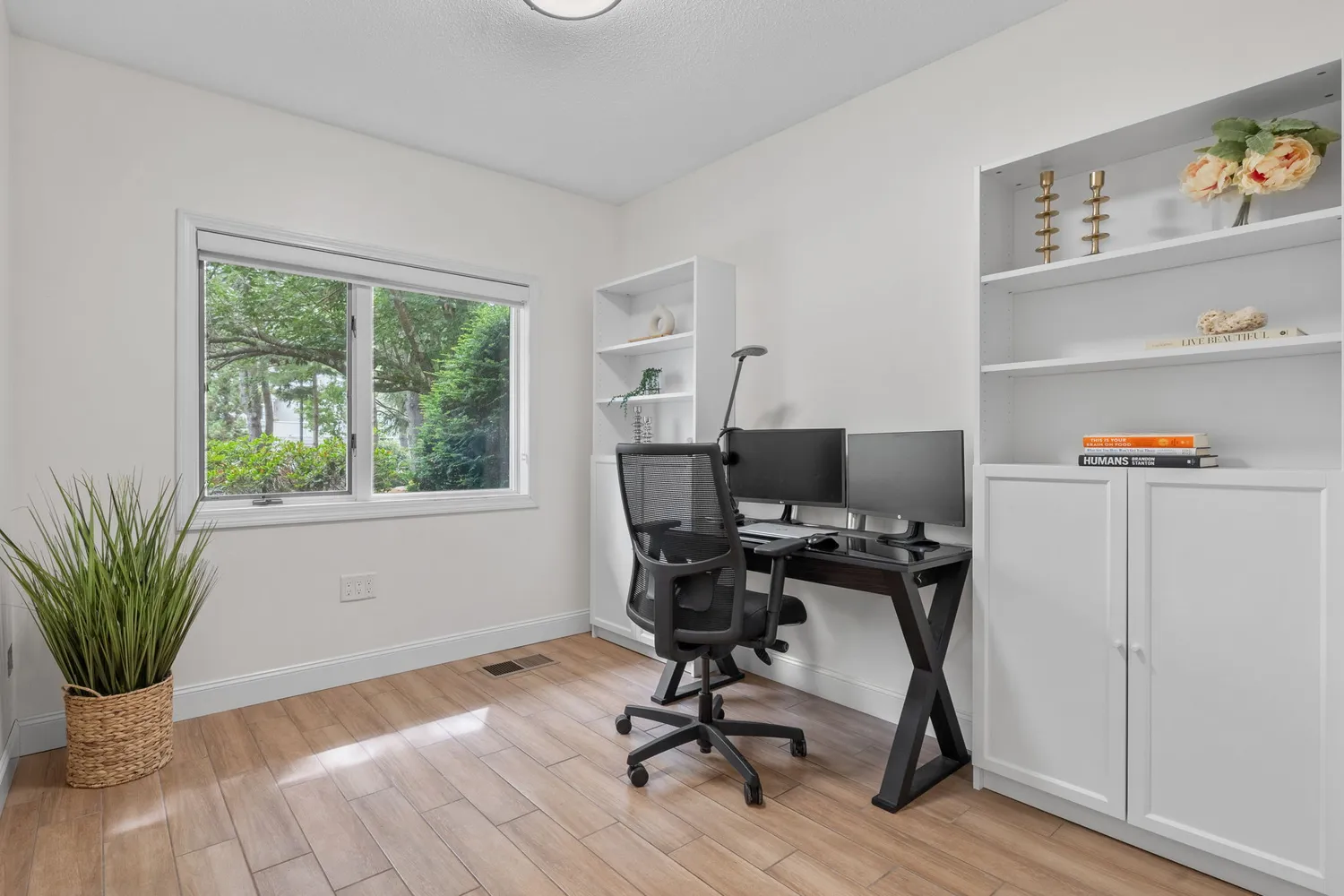 a living room with furniture pool table and a flat screen tv