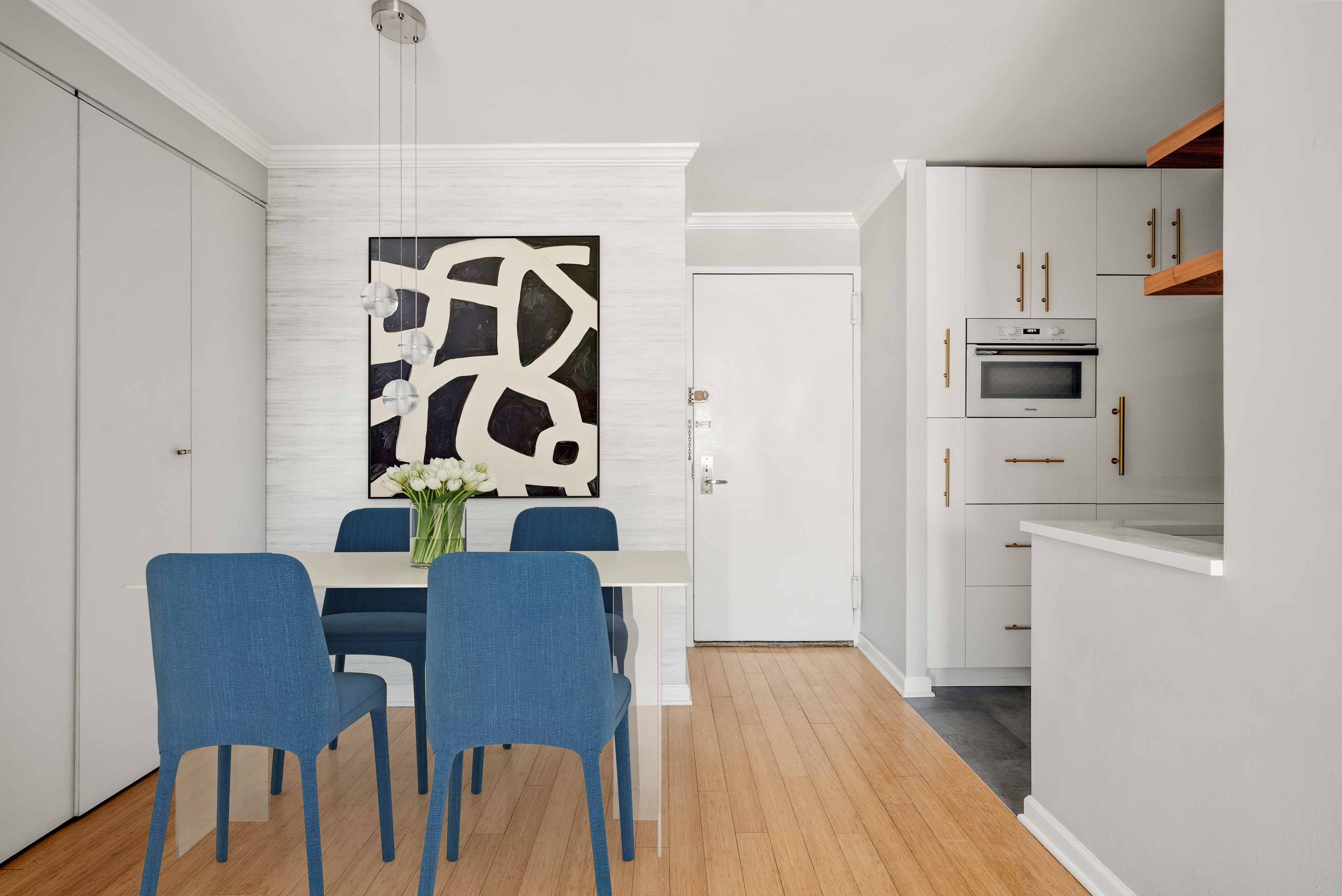 201 East 17th Street, Unit 14F Manhattan, NY 10003 - Photo 3 of 8 a view of kitchen with stainless steel appliances granite countertop furniture and a refrigerator