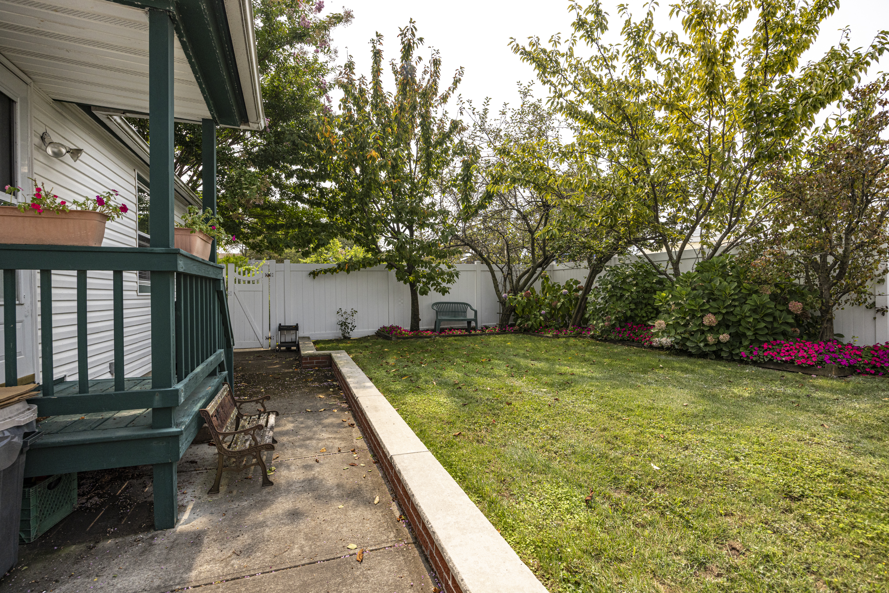 355 D Dormans Court Queens, NY 11693 - Photo 14 of 21 a view of a backyard with large trees