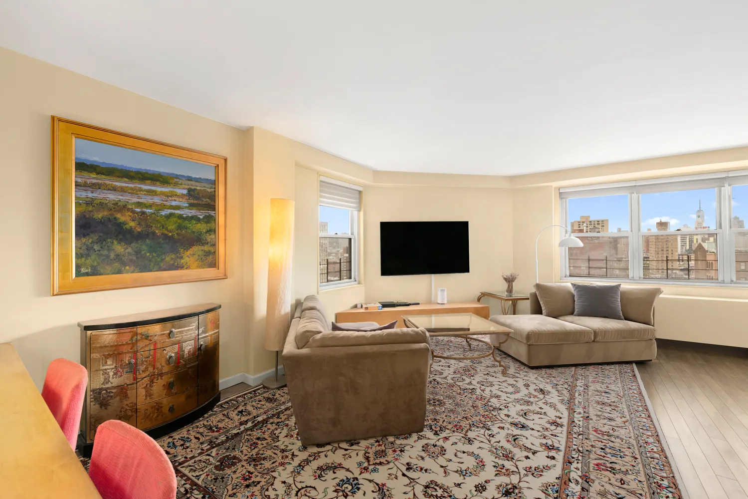 a living room with furniture and a flat screen tv