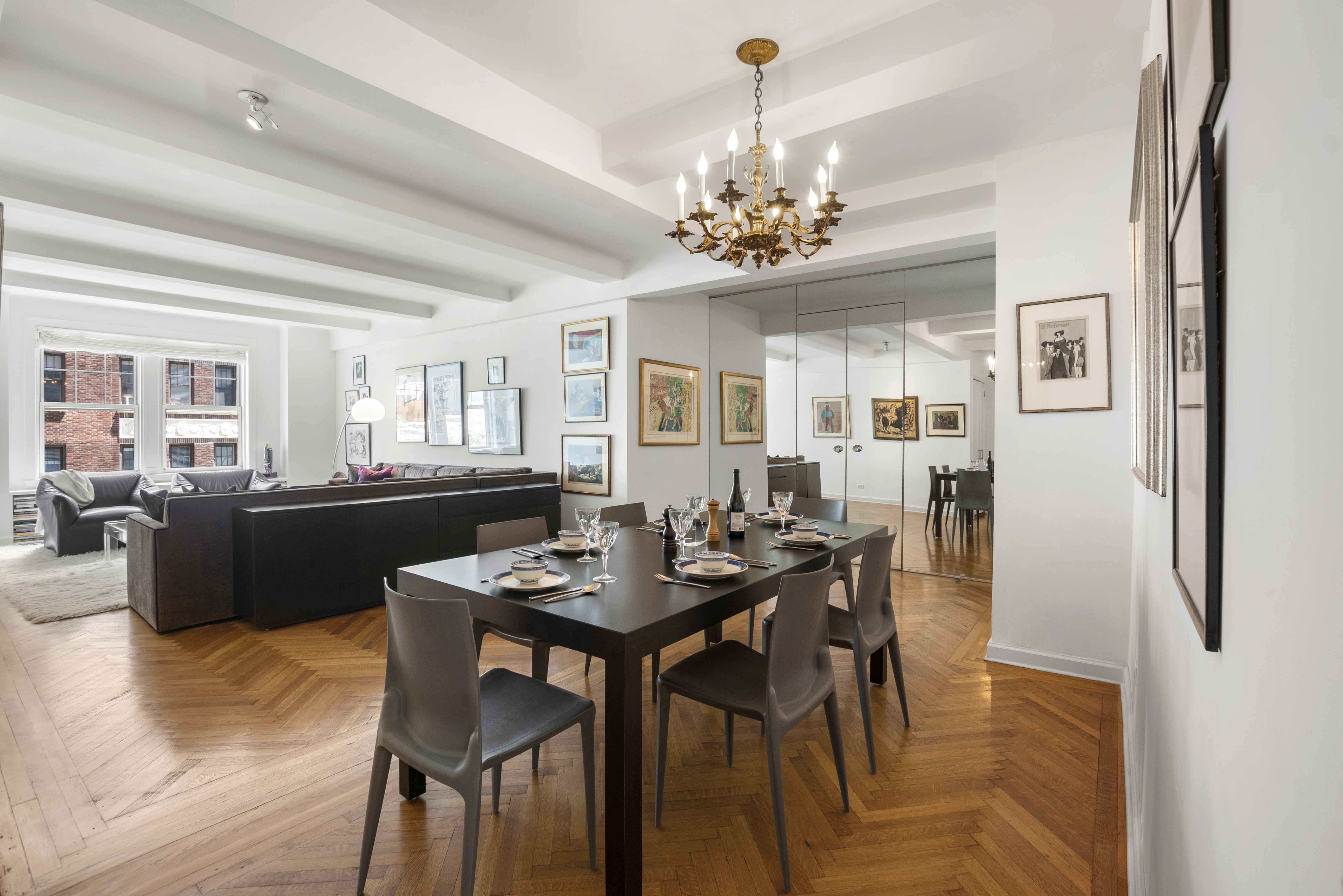 575 Park Avenue, Unit 407 Manhattan, NY 10065 - Photo 2 of 14 a view of a dining room with furniture and chandelier