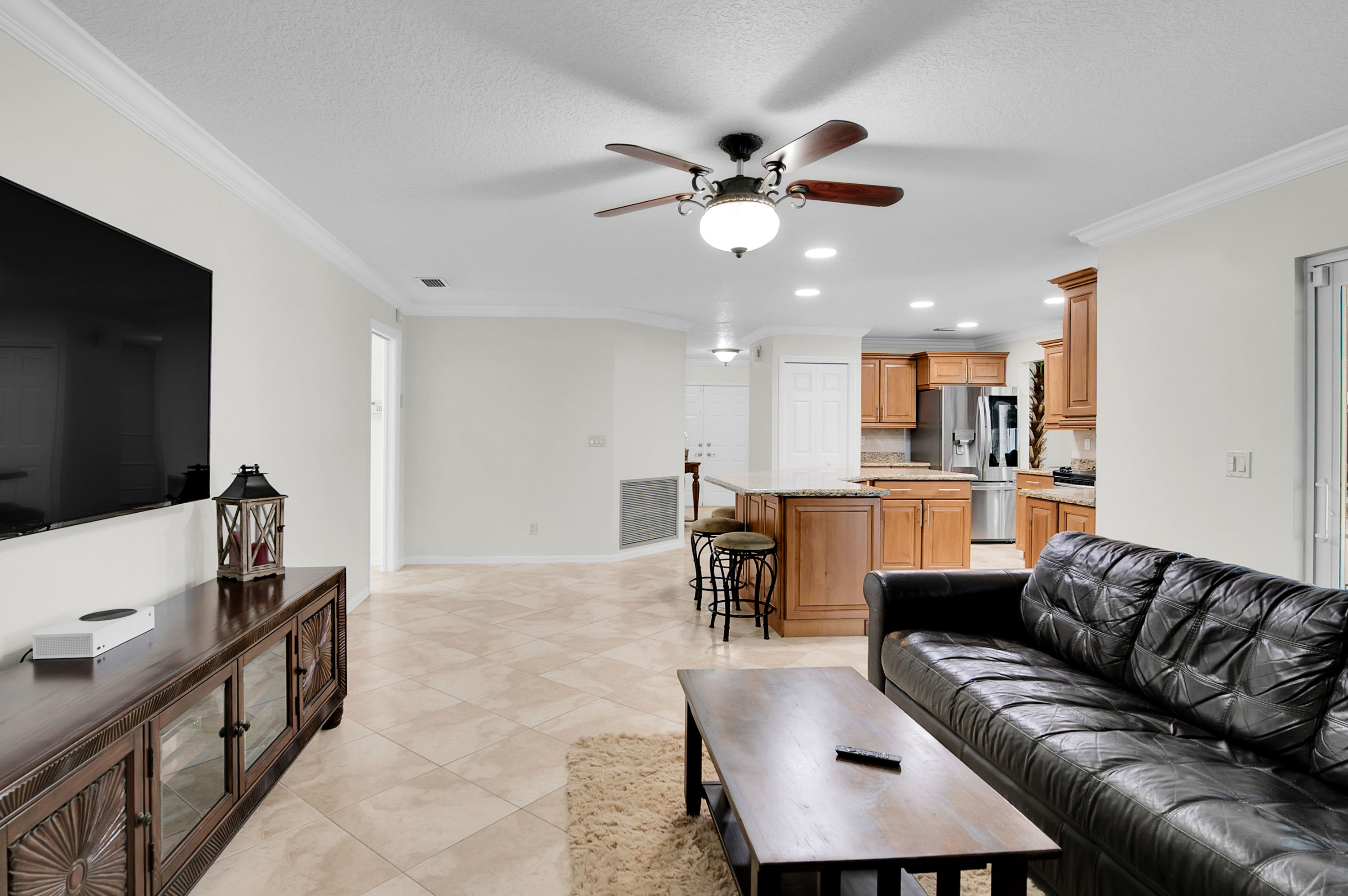 1560 Southwest 16th Street Boca Raton, FL 33486 - Photo 44 of 72 a living room with furniture and kitchen view