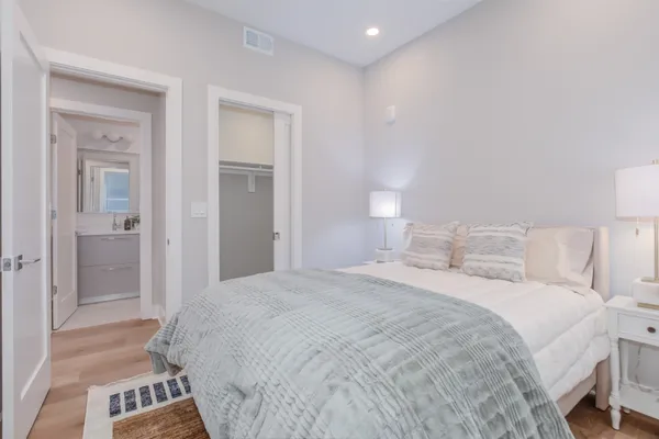 a bedroom with a bed and a view of bathroom