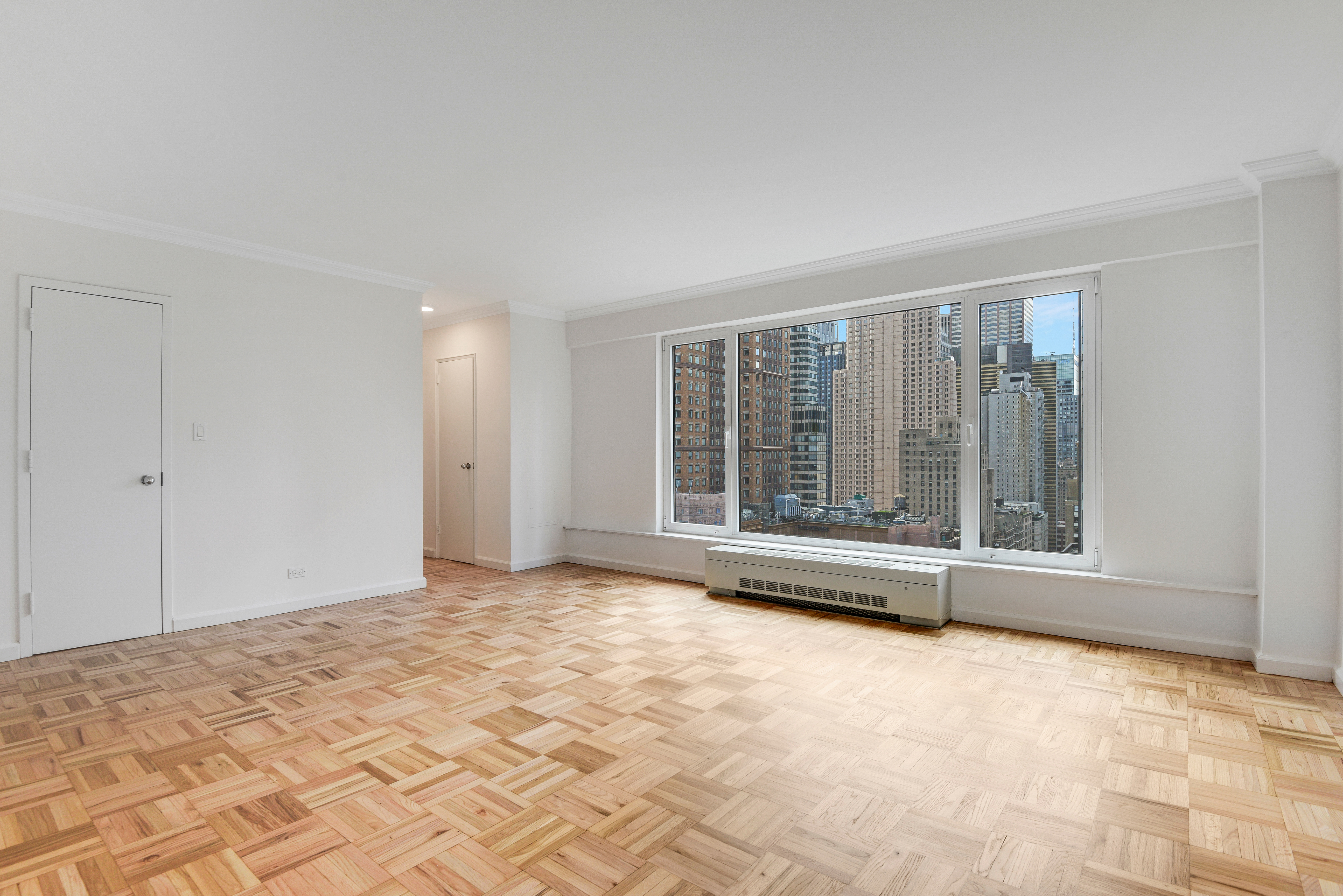 200 Central Park South, Unit 29C Manhattan, NY 10019 - Photo 13 of 23 a view of an empty room with a window