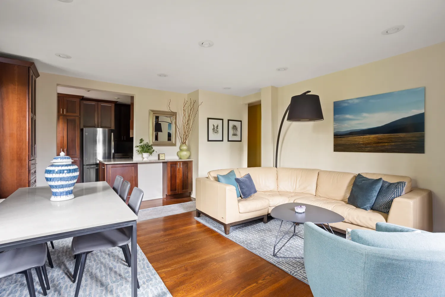 a living room with furniture and a lamp