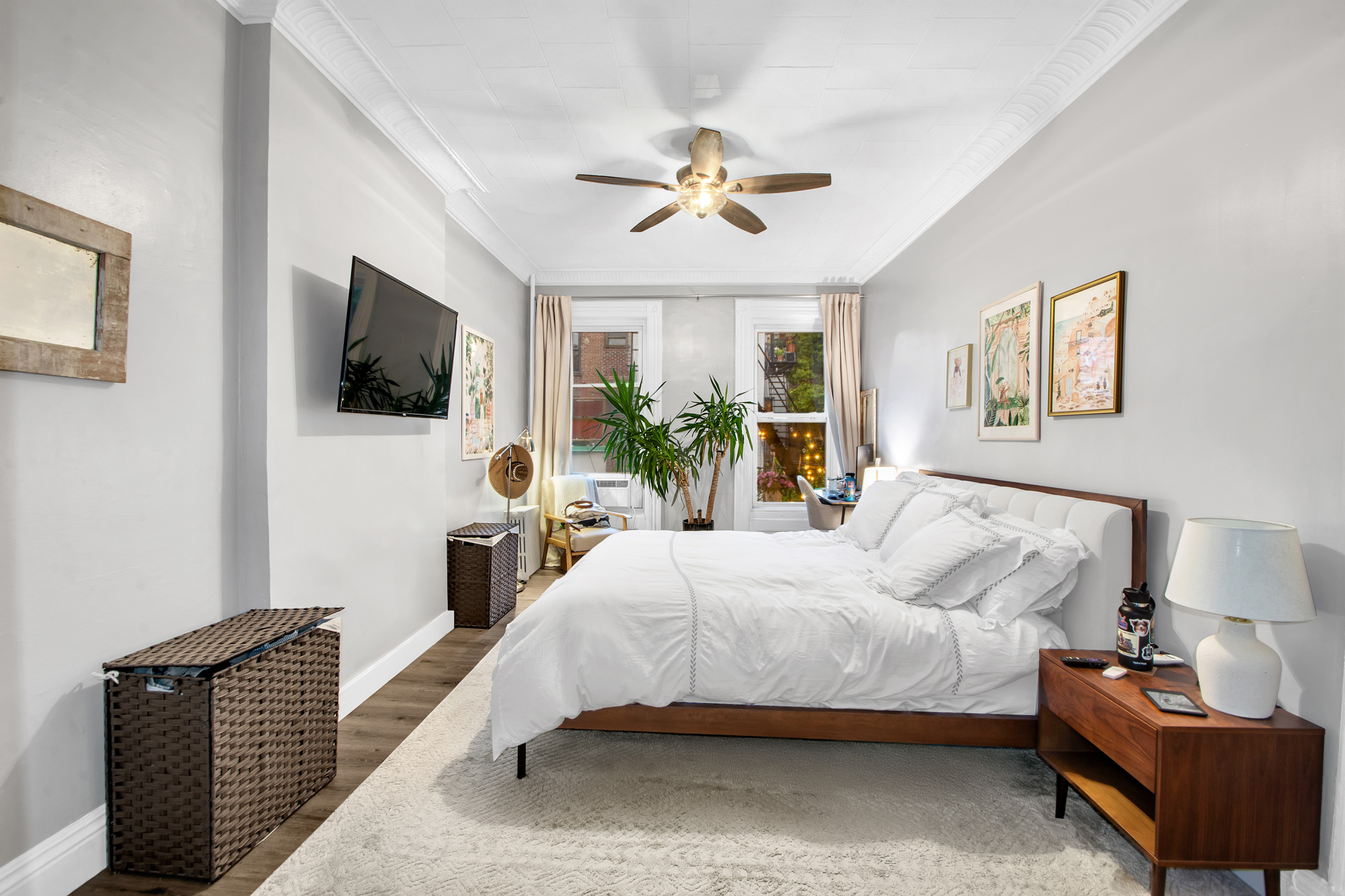 545 10th Street Brooklyn, NY 11215 - Photo 4 of 11 a bedroom with a bed and a flat screen tv