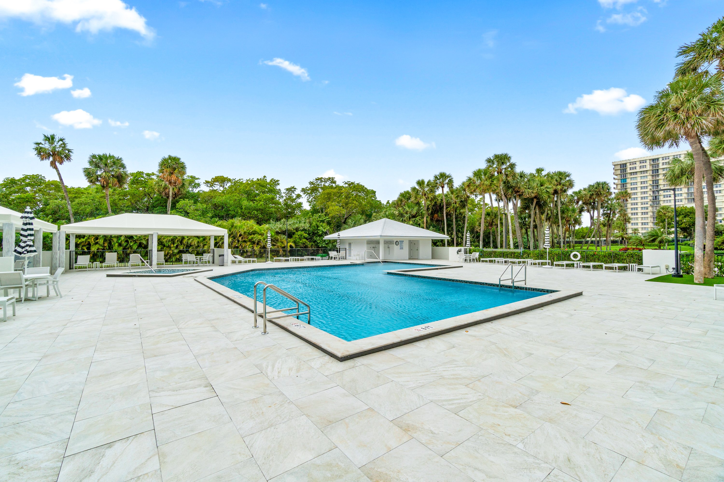 2003 North Ocean Boulevard, Unit 305 Boca Raton, FL 33431 - Photo 53 of 56 a view of a tennis ground with a large trees