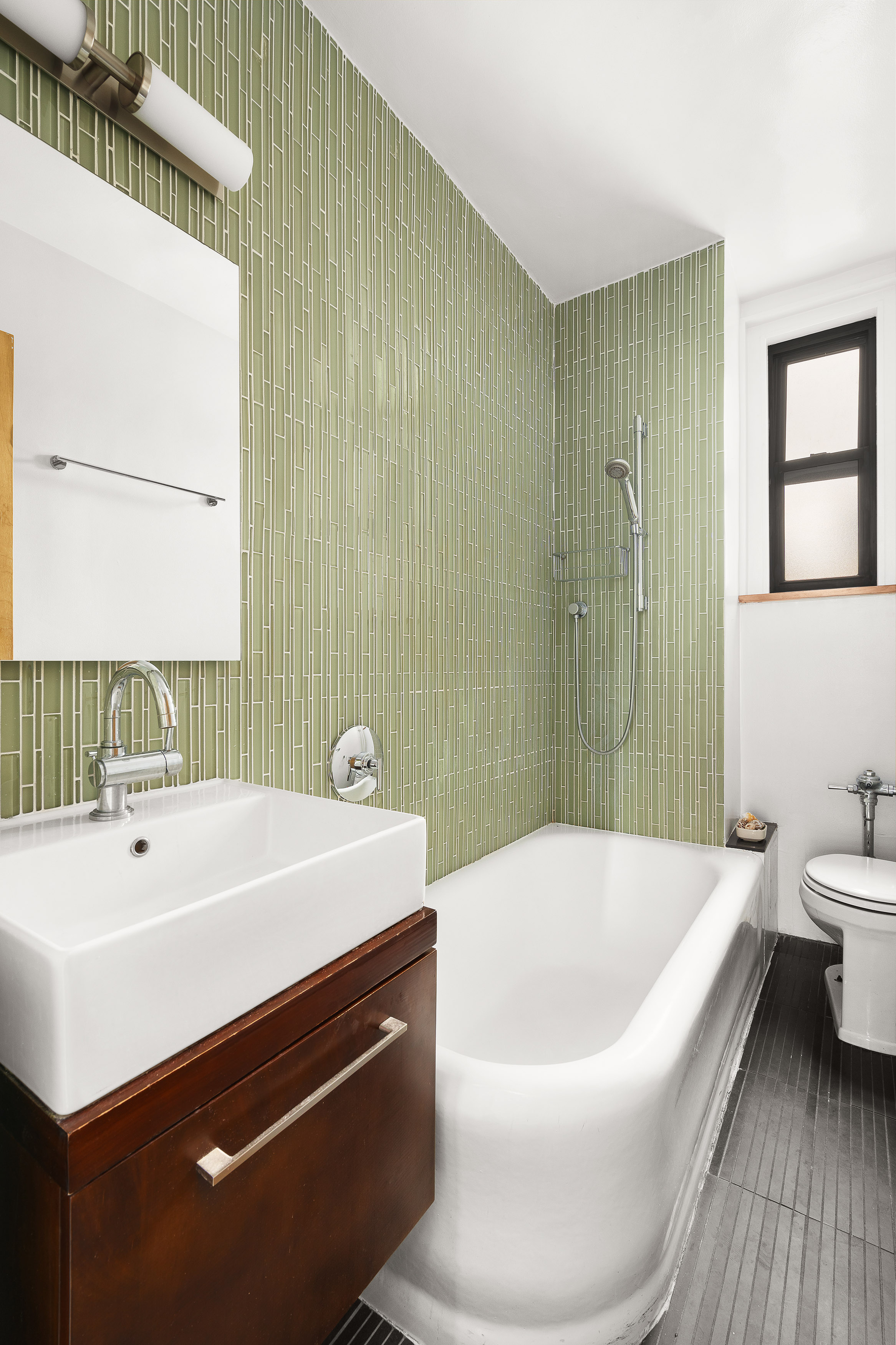 50 West 106th Street, Unit 6D Manhattan, NY 10025 - Photo 6 of 8 a bathroom with a sink a toilet and shower