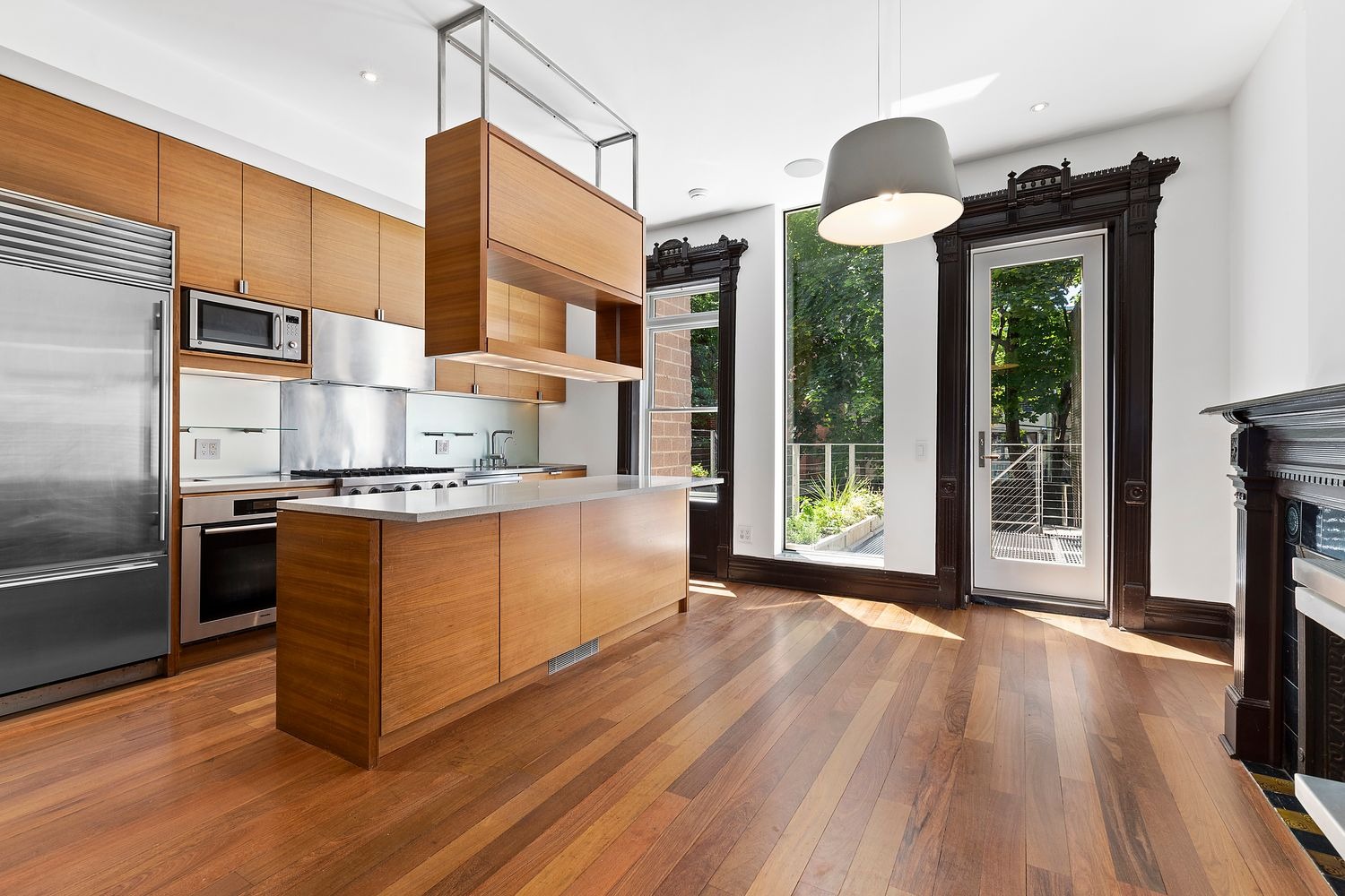 64 Clifton Place, Unit PARLOR Brooklyn, NY 11238 - Photo 6 of 17 a kitchen with stainless steel appliances granite countertop a stove a refrigerator a sink and wooden floors