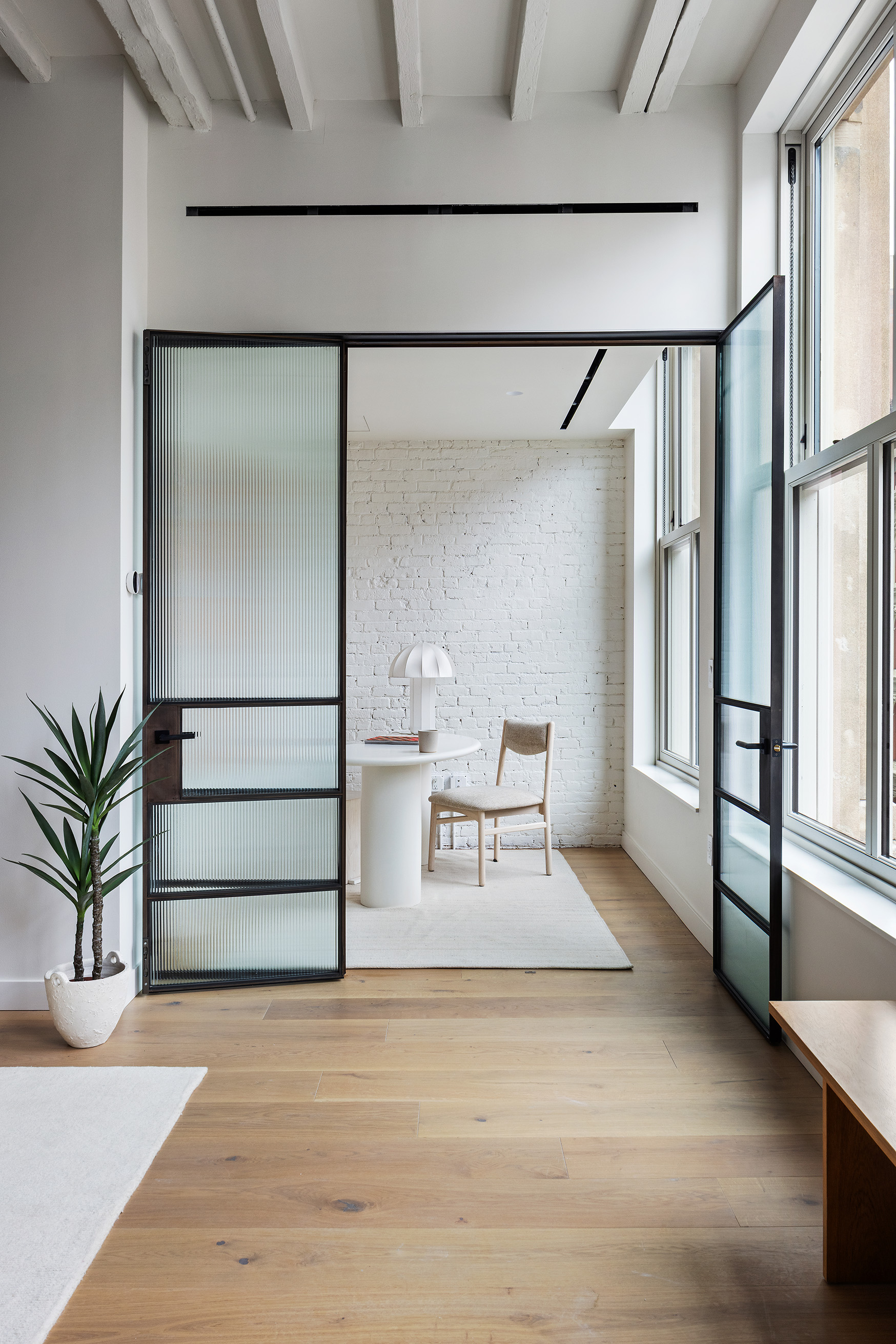 62 Reade Street, Unit 4 Manhattan, NY 10007 - Photo 5 of 20 a view of staircase with a rug and a potted plant