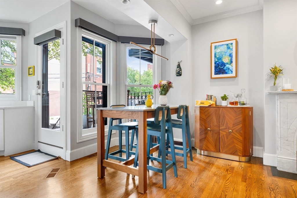135 West Concord Street, Unit 1 Boston, MA 02118 - Photo 11 of 36 a view of a dining room with furniture window and wooden floor