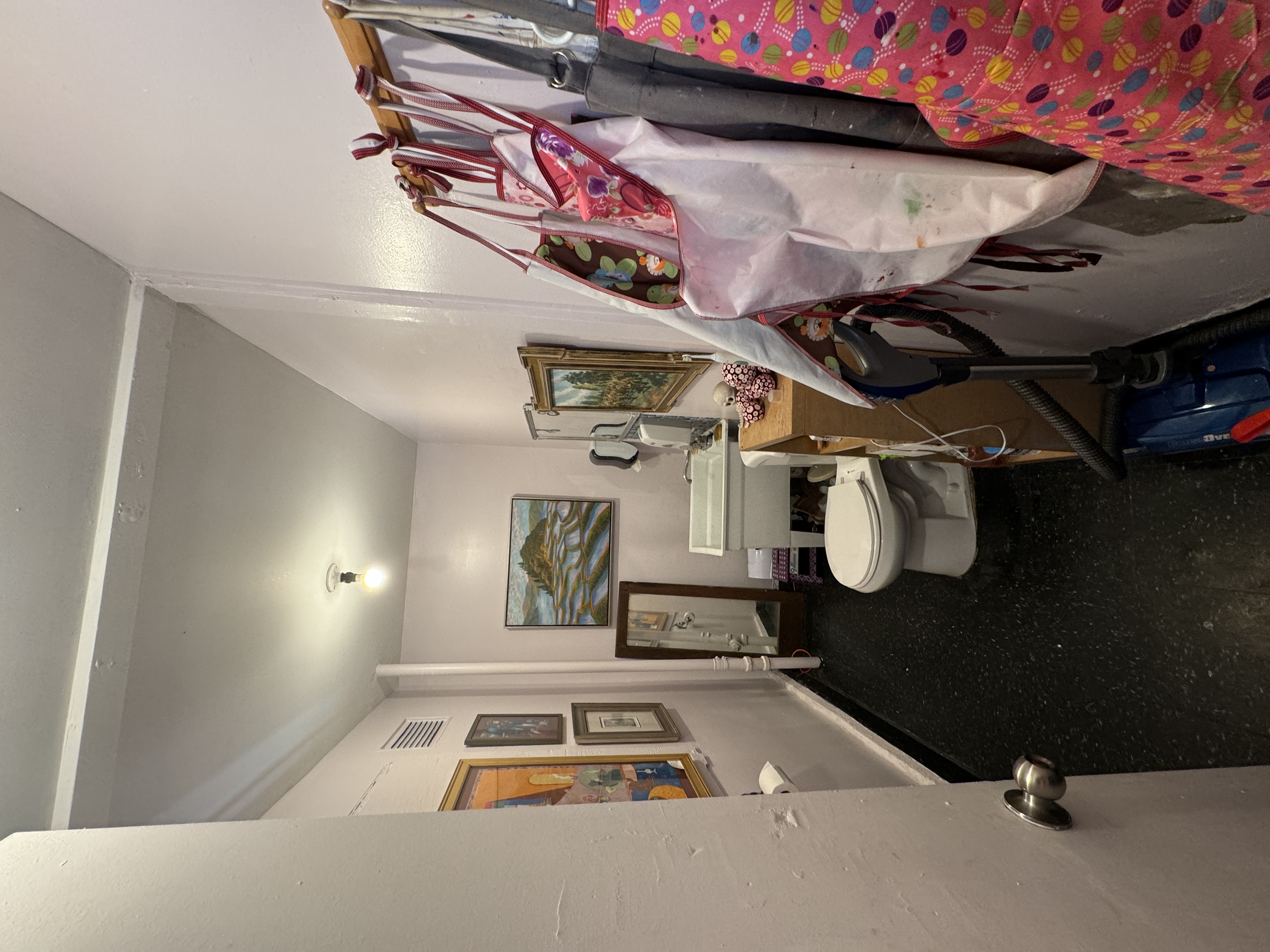 153 Bacon Street San Francisco, CA 94134 - Photo 13 of 26 a living room with furniture and a wooden floor