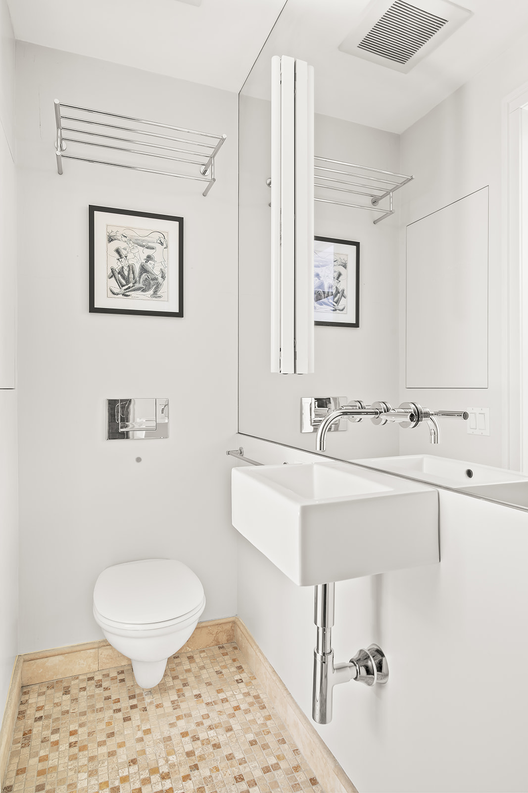 24 West 70th Street, Unit 1 Manhattan, NY 10023 - Photo 10 of 11 a bathroom with a sink mirror vanity and toilet