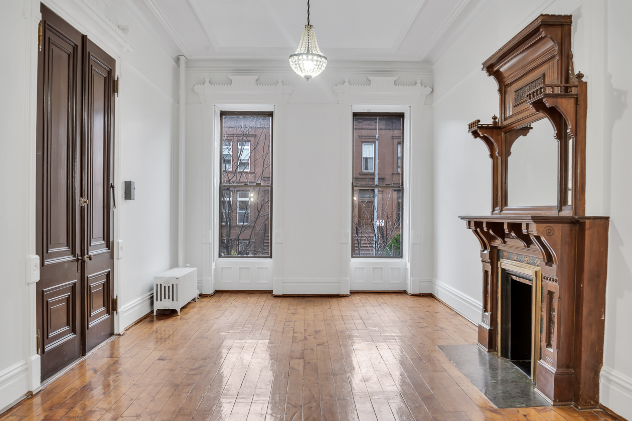 385 Madison Street, Unit 1 Brooklyn, NY 11221 - Photo 20 of 21 wooden floor in an empty room with a window