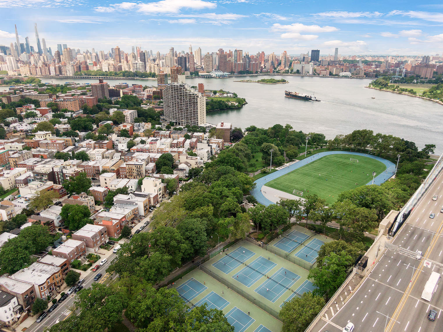 12-16 30th Avenue, Unit 303 Queens, NY 11102 - Photo 15 of 18 a view of a lake with a city