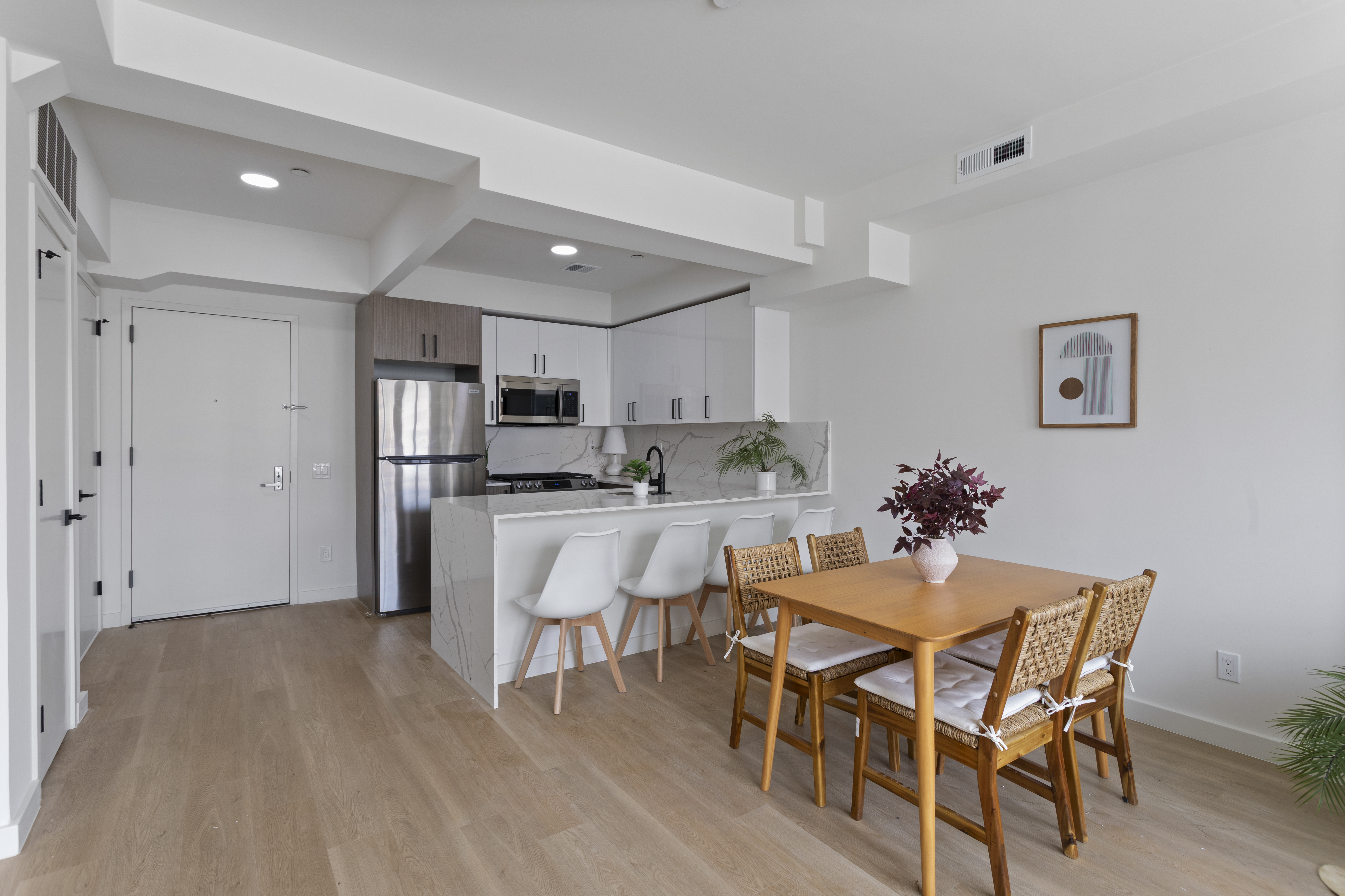3112 Emmons Avenue, Unit 104 Brooklyn, NY 11235 - Photo 4 of 12 a view of a dining room with furniture and wooden floor