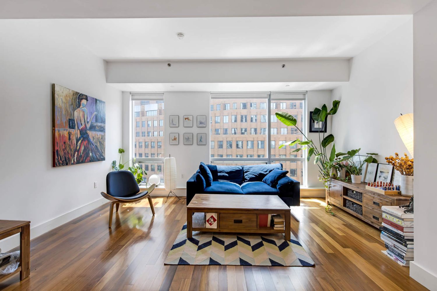 150 Myrtle Avenue, Unit 805 Brooklyn, NY 11201 - Photo 2 of 26 a living room with furniture and wooden floor