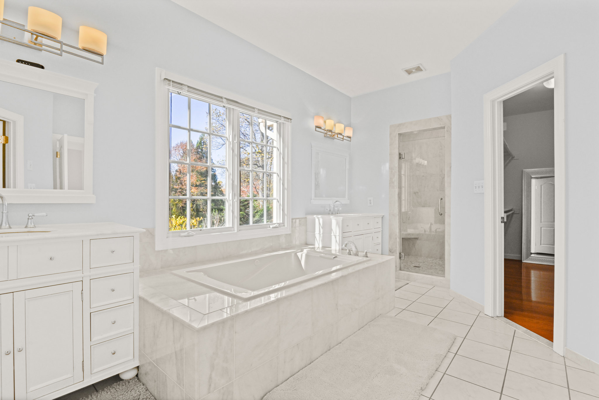 2628 Five Oaks Road Vienna, VA 22181 - Photo 24 of 40 a spacious bathroom with a bathtub and next to a window