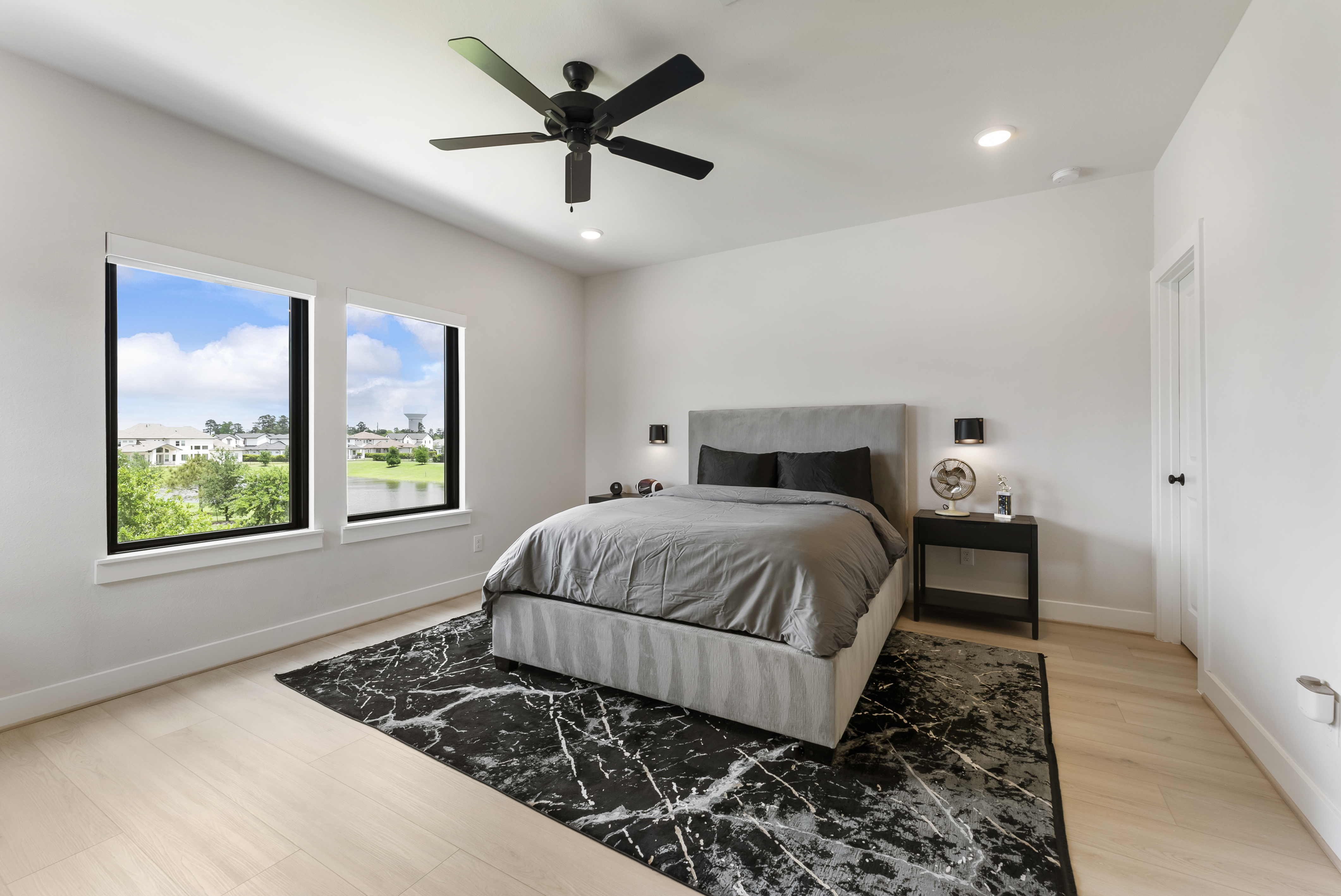 2118 Bennet Court Conroe, TX 77384 - Photo 58 of 70 a bedroom with a bed and a window