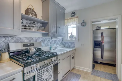 a kitchen with a stove and a refrigerator