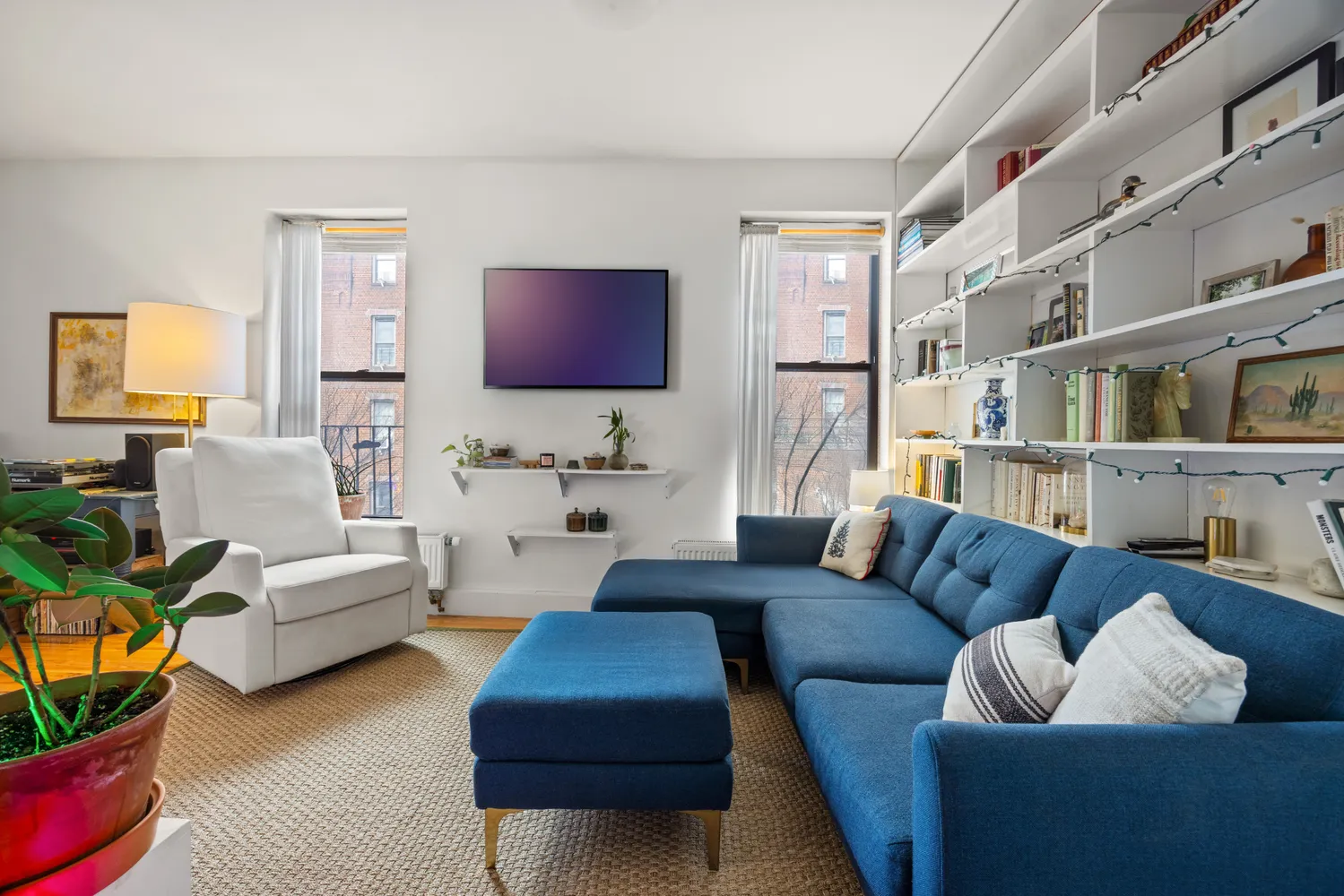a living room with furniture and a flat screen tv