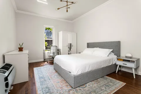 a bed room with a bed and a window